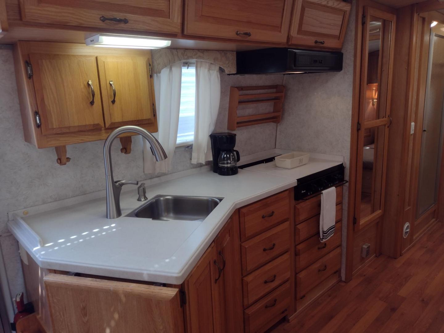2003 Silver /TAN AIRSTREAM M30 LIMITED M30 LIMITED (1STJBBP213J) , located at 17760 Hwy 62, Morris, OK, 74445, 35.609104, -95.877060 - GRAB IT WHILE YOU CAN!!! 2003 AIRSTREAM CLASSIC LIMITED M30 WITH SLIDE OUT OVERALL 31FT. IN THE LIVING/KITCHEN AREA IS LEATHER SOFA THAT FOLDS DOWN FOR ADDITIONAL SLEEPING, STORAGE DRAWER UNDER SOFA, HAS A SIDE TABLE, OVERHEAD STORAGE CABINETS, LEATHER BOOTH STYLE DINETTE THAT FOLDS DOWN FOR ADDITIO - Photo#19