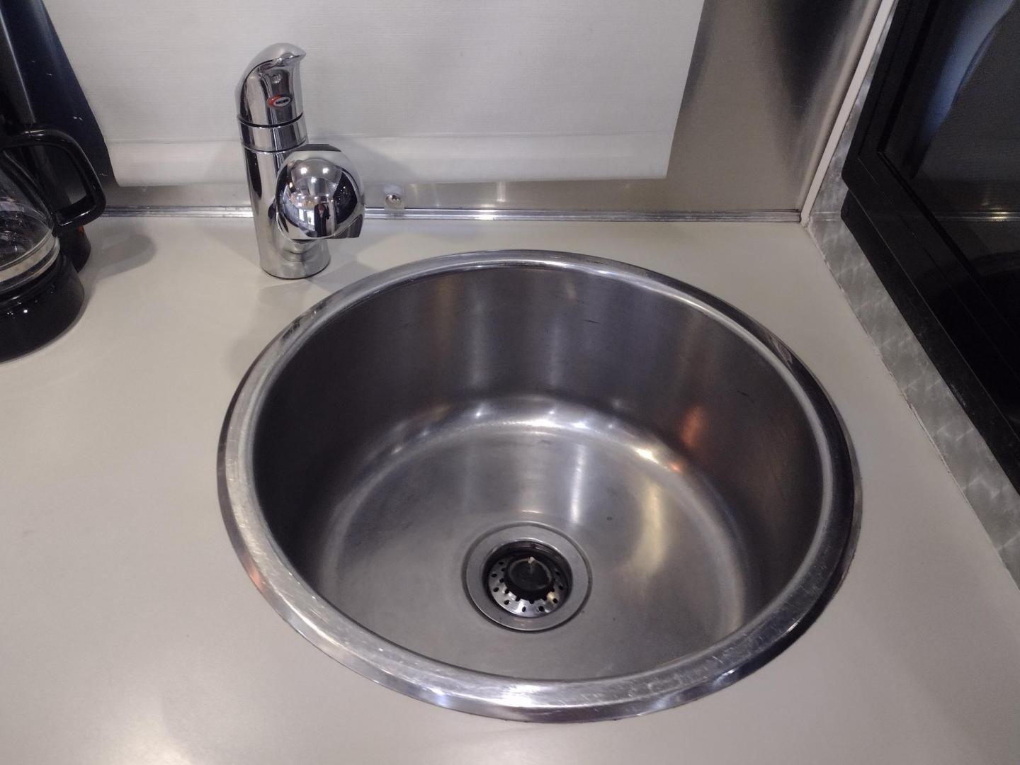 2007 Silver Airstream OCEAN BREEZE 25CCD 25CCD (1STCFYJ2X7J) , located at 17760 Hwy 62, Morris, OK, 74445, 35.609104, -95.877060 - CAMPING SEASON IS HERE GRAB IT WHILE YOU CAN!!! A 2007 AIRSTREAM INTERNATIONAL OCEAN BREEZE 25CCD OVERALL 26FT. IN THE FRONT IS THE LIVING/KITCHEN AREA THAT FEATURES A CLOTH COUCH WITH OVERHEAD CABINET, STORAGE UNDER THE COUCH, BOOTH STYLE DINETTE THAT FOLDS DOWN FOR ADDITIONAL SLEEPING, OVERHEAD C - Photo#15