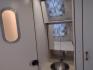 2007 Silver Airstream OCEAN BREEZE 25CCD 25CCD (1STCFYJ2X7J) , located at 17760 Hwy 62, Morris, OK, 74445, 35.609104, -95.877060 - CAMPING SEASON IS HERE GRAB IT WHILE YOU CAN!!! A 2007 AIRSTREAM INTERNATIONAL OCEAN BREEZE 25CCD OVERALL 26FT. IN THE FRONT IS THE LIVING/KITCHEN AREA THAT FEATURES A CLOTH COUCH WITH OVERHEAD CABINET, STORAGE UNDER THE COUCH, BOOTH STYLE DINETTE THAT FOLDS DOWN FOR ADDITIONAL SLEEPING, OVERHEAD C - Photo#24
