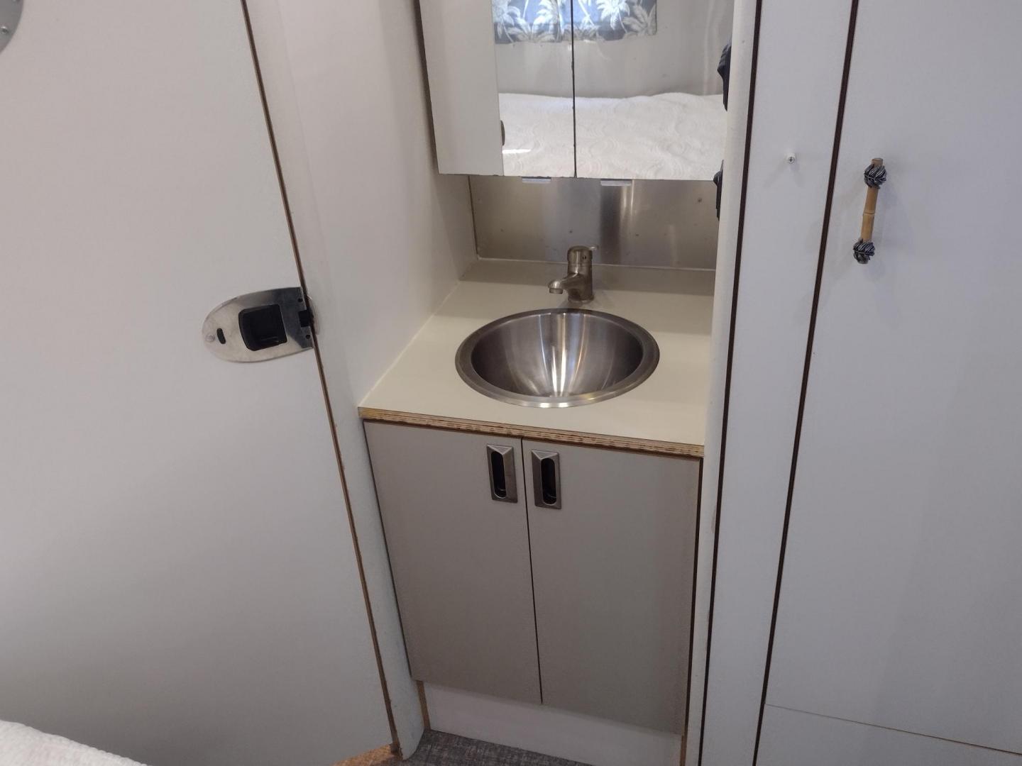 2007 Silver Airstream OCEAN BREEZE 25CCD 25CCD (1STCFYJ2X7J) , located at 17760 Hwy 62, Morris, OK, 74445, 35.609104, -95.877060 - CAMPING SEASON IS HERE GRAB IT WHILE YOU CAN!!! A 2007 AIRSTREAM INTERNATIONAL OCEAN BREEZE 25CCD OVERALL 26FT. IN THE FRONT IS THE LIVING/KITCHEN AREA THAT FEATURES A CLOTH COUCH WITH OVERHEAD CABINET, STORAGE UNDER THE COUCH, BOOTH STYLE DINETTE THAT FOLDS DOWN FOR ADDITIONAL SLEEPING, OVERHEAD C - Photo#25