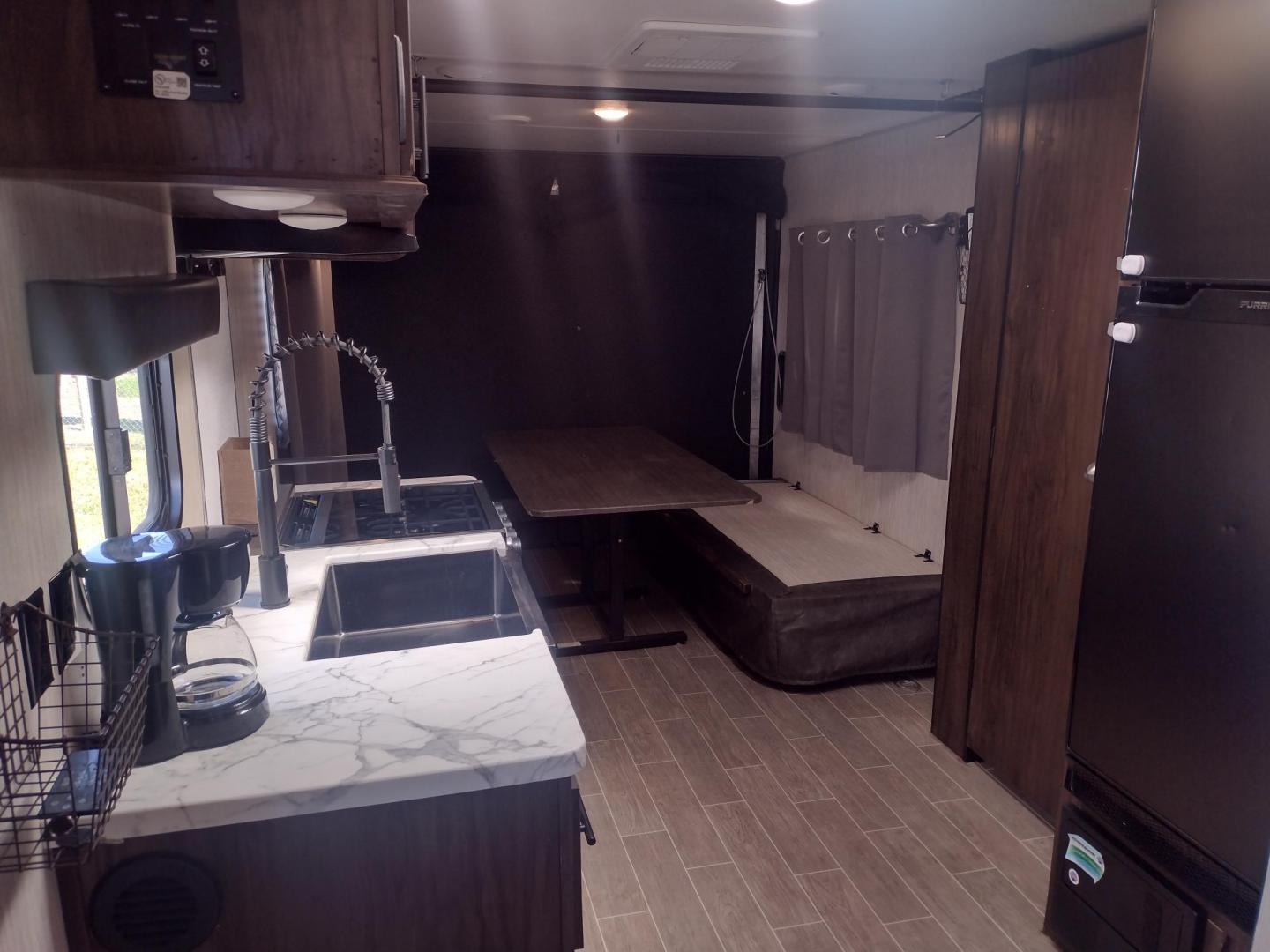 2020 Silver Forest River GREY WOLF PUP 22RR 22RR (4X4TCKX24LK) , located at 17760 Hwy 62, Morris, OK, 74445, 35.609104, -95.877060 - CAMPING SEASON IS HERE! CHECK OUT THIS 2020 FOREST RIVER GREY WOLF PUP TOY HAULER 22RR 29FT OVERALL WITH A 15FT POWER AWNING. IN THE LIVING/KITCHEN AREA IS A FARM STYLE SINK WITH OVERHEAD CABINETS, 3 BURNER STOVE WITH OVEN, OVERHEAD MICROWAVE, PANTRY, MID-SIZE FRIDGE, AM/FM RADIO, BOOTH STYLE DINETT - Photo#15