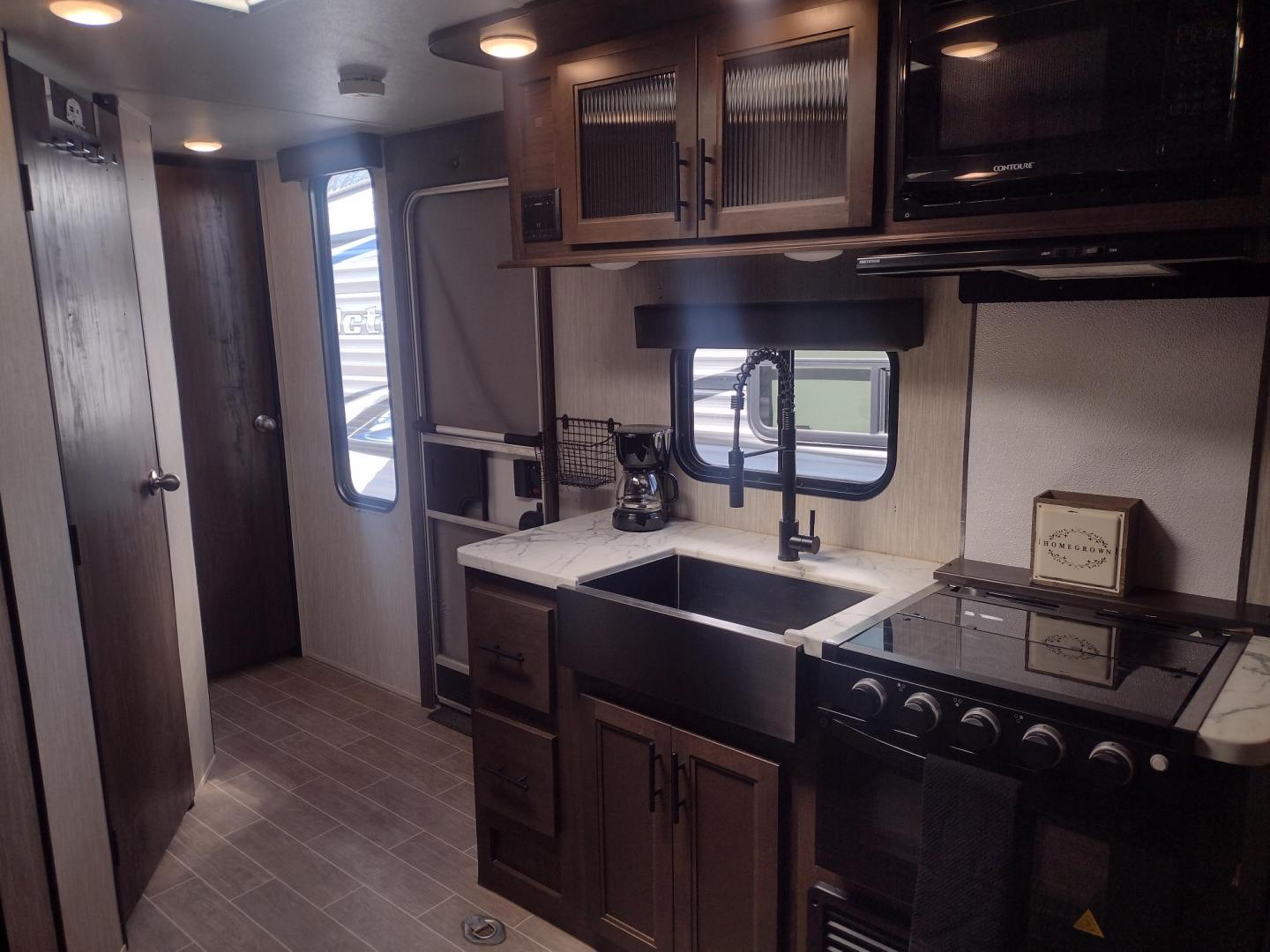 2020 Silver Forest River GREY WOLF PUP 22RR 22RR (4X4TCKX24LK) , located at 17760 Hwy 62, Morris, OK, 74445, 35.609104, -95.877060 - CAMPING SEASON IS HERE! CHECK OUT THIS 2020 FOREST RIVER GREY WOLF PUP TOY HAULER 22RR 29FT OVERALL WITH A 15FT POWER AWNING. IN THE LIVING/KITCHEN AREA IS A FARM STYLE SINK WITH OVERHEAD CABINETS, 3 BURNER STOVE WITH OVEN, OVERHEAD MICROWAVE, PANTRY, MID-SIZE FRIDGE, AM/FM RADIO, BOOTH STYLE DINETT - Photo#16