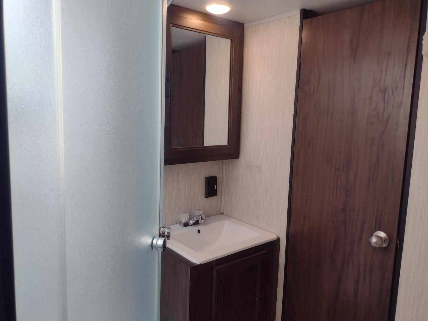 2020 Silver Forest River GREY WOLF PUP 22RR 22RR (4X4TCKX24LK) , located at 17760 Hwy 62, Morris, OK, 74445, 35.609104, -95.877060 - CAMPING SEASON IS HERE! CHECK OUT THIS 2020 FOREST RIVER GREY WOLF PUP TOY HAULER 22RR 29FT OVERALL WITH A 15FT POWER AWNING. IN THE LIVING/KITCHEN AREA IS A FARM STYLE SINK WITH OVERHEAD CABINETS, 3 BURNER STOVE WITH OVEN, OVERHEAD MICROWAVE, PANTRY, MID-SIZE FRIDGE, AM/FM RADIO, BOOTH STYLE DINETT - Photo#29