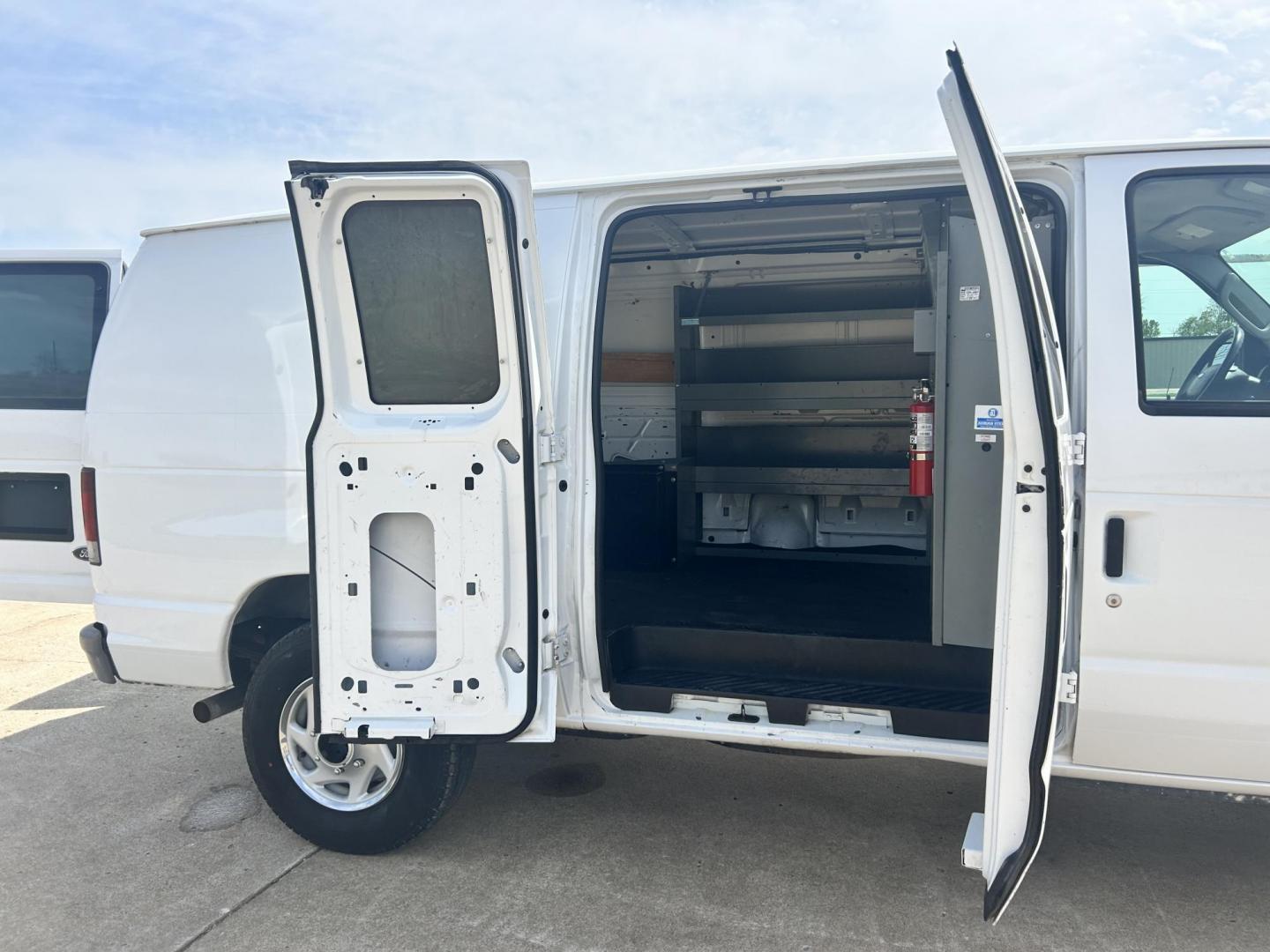 2009 White /Gray Ford E-Series Van E-250 (1FTNE24L49D) with an 5.4L V8 SOHC 16V engine, 4-Speed Automatic transmission, located at 17760 Hwy 62, Morris, OK, 74445, (918) 733-4887, 35.609104, -95.877060 - 2009 FORD E-SERIES VAN E-250 5.4 V8 DEDICATED CNG (COMPRESSED NATURAL GAS) DOES NOT RUN ON GASOLINE. FEATURES MANUAL SEATS, MANUAL LOCKS, MANUAL WINDOWS, MANUAL MIRRORS, AM/FM RADIO, AND WORK SHELF IN THE REAR. IT IS EQUIPPED WITH A CNG FUELING SYSTEM, IT RUNS ON COMPRESSED NATURAL GAS. A PREMIER AL - Photo#15