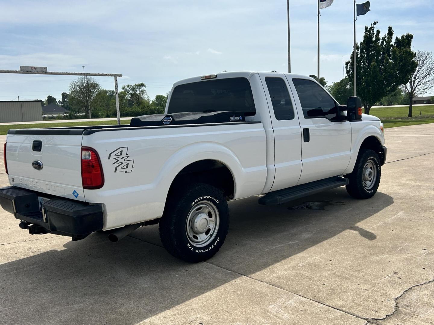 2014 White /Gray Ford F-250 SD XLT SuperCab Long Bed 4WD (1FT7X2B67EE) with an 6.2L V8 OHV 16V engine, 6-Speed Automatic transmission, located at 17760 Hwy 62, Morris, OK, 74445, (918) 733-4887, 35.609104, -95.877060 - 2014 F250 SUPER DUTY 4WD IS A BI-FUEL SYSTEM THAT RUNS ON CNG OR GASOLINE. THIS TRUCK HAS A 6.2L V8 ENGINE, FEATURES MANUAL SEAT, POWER WINDOWS, POWER LOCKS, POWER MIRRORS, AM FM RADIO, TRACTION CONTROL, CRUISE CONTROL, BED LINER AND TRAILER HITCH. A PREMIER ALTERNATIVE FUEL CONVERSION THAT IS EPA - Photo#4