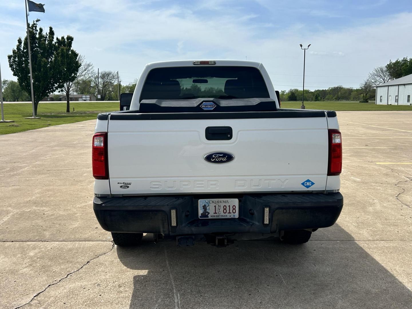 2014 White /Gray Ford F-250 SD XLT SuperCab Long Bed 4WD (1FT7X2B67EE) with an 6.2L V8 OHV 16V engine, 6-Speed Automatic transmission, located at 17760 Hwy 62, Morris, OK, 74445, (918) 733-4887, 35.609104, -95.877060 - 2014 F250 SUPER DUTY 4WD IS A BI-FUEL SYSTEM THAT RUNS ON CNG OR GASOLINE. THIS TRUCK HAS A 6.2L V8 ENGINE, FEATURES MANUAL SEAT, POWER WINDOWS, POWER LOCKS, POWER MIRRORS, AM FM RADIO, TRACTION CONTROL, CRUISE CONTROL, BED LINER AND TRAILER HITCH. A PREMIER ALTERNATIVE FUEL CONVERSION THAT IS EPA - Photo#5