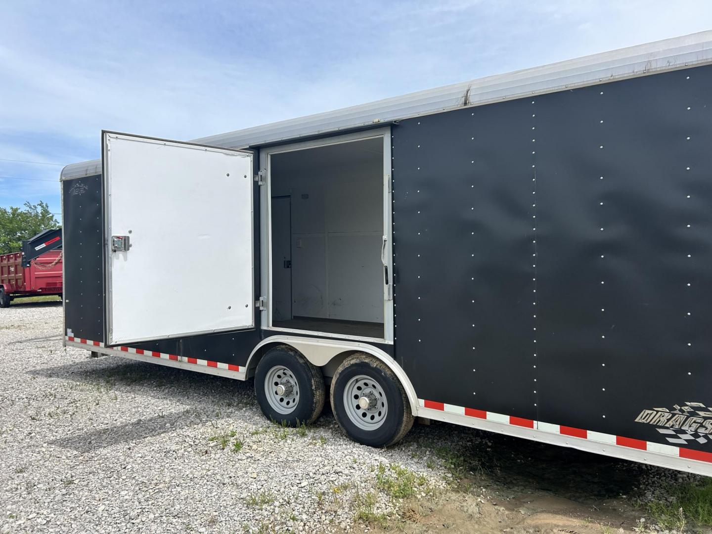 2018 BLACK Cargo Craft, Inc DRAGSTER CAR HAULER - (4D6EB2429JC) , located at 17760 Hwy 62, Morris, OK, 74445, 35.609104, -95.877060 - 2018 CARGO CRAFT, INC DRAGSTER CAR HAULER 24.5FTX8FT. TWO SIDE DOORS AND DUAL AXLES. PAYLOAD CAPACITY 10,400LBS, HITCH WEIGHT 6,000LBS, AND HITCH SIZE 2 5/16 BALL SIZE. ***BILL OF SALE ONLY*** $7,500 CALL RUSS, JONA OR HARLEY 918-733-4887 - Photo#7