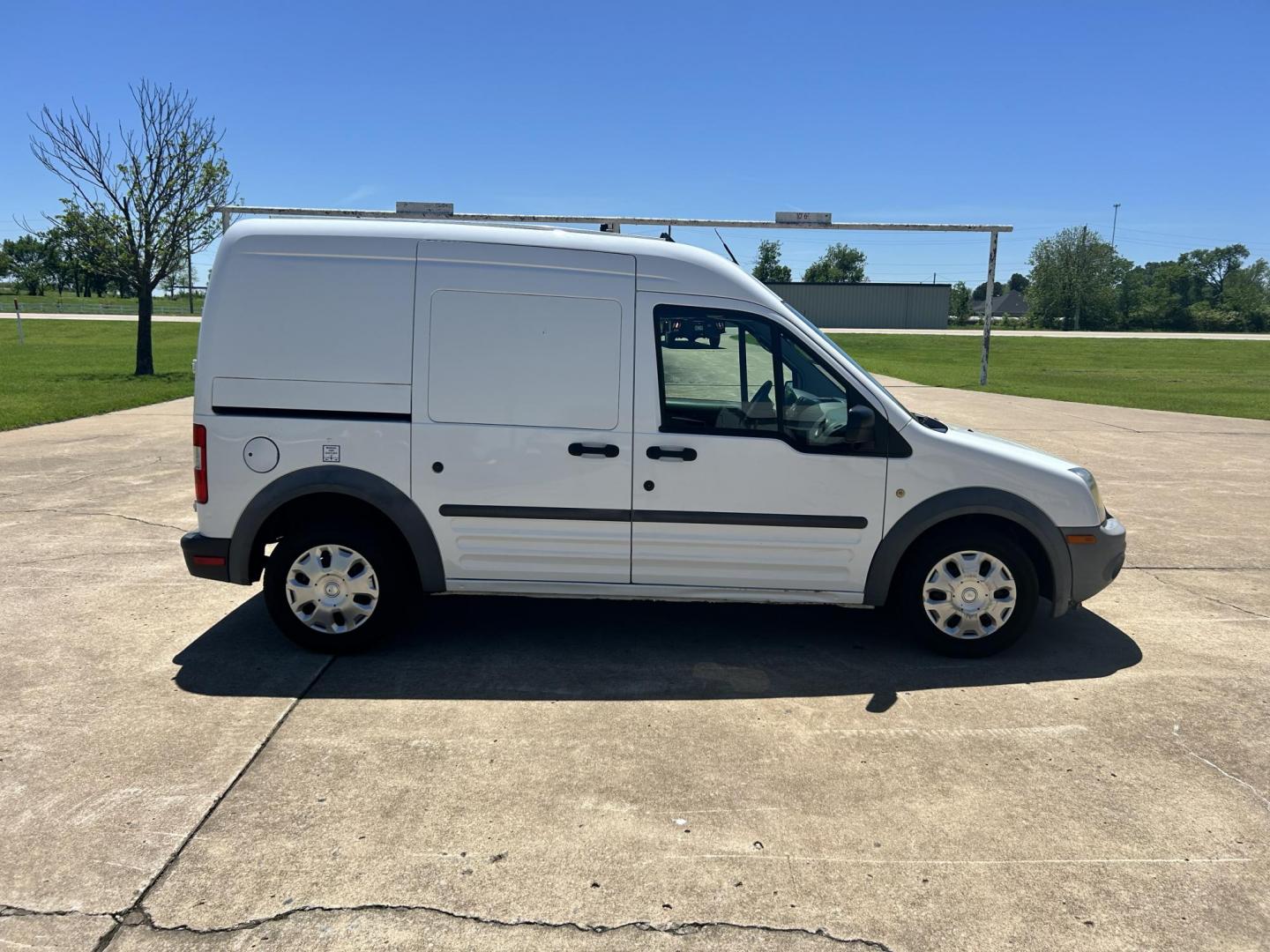 2012 White /Gray Ford Transit Connect XL with Rear Door Glass (NM0LS7AN8CT) with an 2.0L L4 DOHC 16V engine, 4-Speed Automatic transmission, located at 17760 Hwy 62, Morris, OK, 74445, (918) 733-4887, 35.609104, -95.877060 - 2012 FORD TRANSIT CONNECT HAS THE 2.0L ENGINE. THIS IS A DEDICATED CNG THAT ONLY RUNS ON COMPRESSED NATURAL GAS AND IS NOT EQUIPPED TO RUN ON GASOLINE. IT FEATURES MANUAL WINDOWS, MANUAL LOCKS, MANUAL SEATS, CLOTH INTERIOR, BACKUP CAMERA, AM/FM RADIO, STORAGE DRAWERS IN CARGO AREA, 205/65R15 TIRES - Photo#3