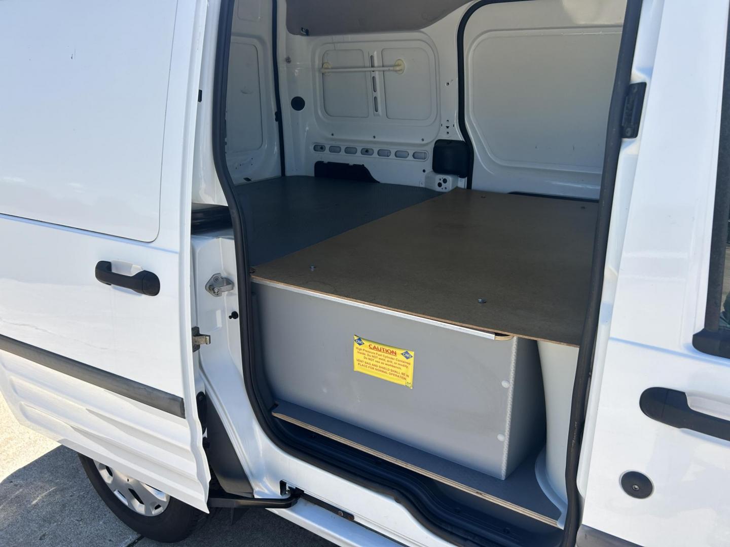 2012 White /Gray Ford Transit Connect XL with Rear Door Glass (NM0LS7AN8CT) with an 2.0L L4 DOHC 16V engine, 4-Speed Automatic transmission, located at 17760 Hwy 62, Morris, OK, 74445, (918) 733-4887, 35.609104, -95.877060 - 2012 FORD TRANSIT CONNECT HAS THE 2.0L ENGINE. THIS IS A DEDICATED CNG THAT ONLY RUNS ON COMPRESSED NATURAL GAS AND IS NOT EQUIPPED TO RUN ON GASOLINE. IT FEATURES MANUAL WINDOWS, MANUAL LOCKS, MANUAL SEATS, CLOTH INTERIOR, BACKUP CAMERA, AM/FM RADIO, STORAGE DRAWERS IN CARGO AREA, 205/65R15 TIRES - Photo#16