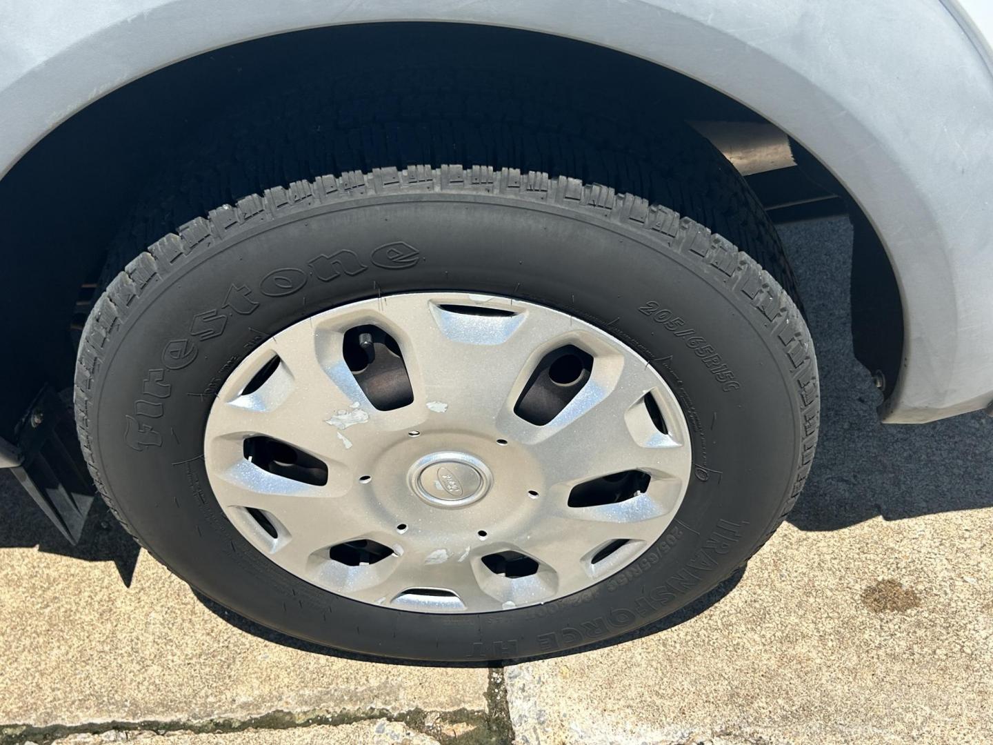 2012 White /Gray Ford Transit Connect XL with Rear Door Glass (NM0LS7AN8CT) with an 2.0L L4 DOHC 16V engine, 4-Speed Automatic transmission, located at 17760 Hwy 62, Morris, OK, 74445, (918) 733-4887, 35.609104, -95.877060 - 2012 FORD TRANSIT CONNECT HAS THE 2.0L ENGINE. THIS IS A DEDICATED CNG THAT ONLY RUNS ON COMPRESSED NATURAL GAS AND IS NOT EQUIPPED TO RUN ON GASOLINE. IT FEATURES MANUAL WINDOWS, MANUAL LOCKS, MANUAL SEATS, CLOTH INTERIOR, BACKUP CAMERA, AM/FM RADIO, STORAGE DRAWERS IN CARGO AREA, 205/65R15 TIRES - Photo#23