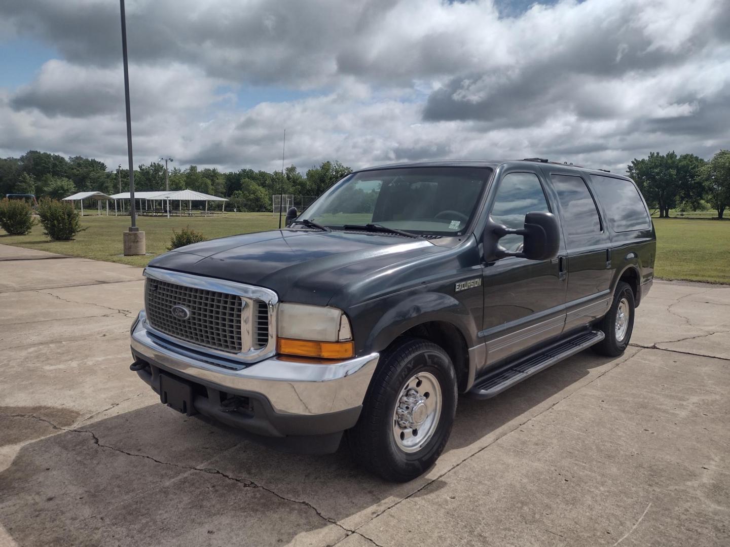 2001 DARK GREEN /TAN Ford Excursion XLT 2WD (1FMNU40S21E) with an 6.8L V10 SOHC 20V engine, 4-Speed Automatic Overdrive transmission, located at 17760 Hwy 62, Morris, OK, 74445, (918) 733-4887, 35.609104, -95.877060 - 2001 FORD EXCURSION XLT 2WD HAS THE 6.8L V10 ENGINE. FEATURES POWER DRIVER SEAT, MANUAL PASSENGER SEAT, POWER LOCKS, POWER WINDOWS, POWER MIRRORS, LEATHER INTERIOR, TOUCH SCREEN AM/FM RADIO, BLUETOOTH RADIO, AUXILLARY PORT, USB PORT, CRUISE CONTROL, 2ND AND 3RD ROW SEATING, REAR AC CONTROL, AND TRAI - Photo#0