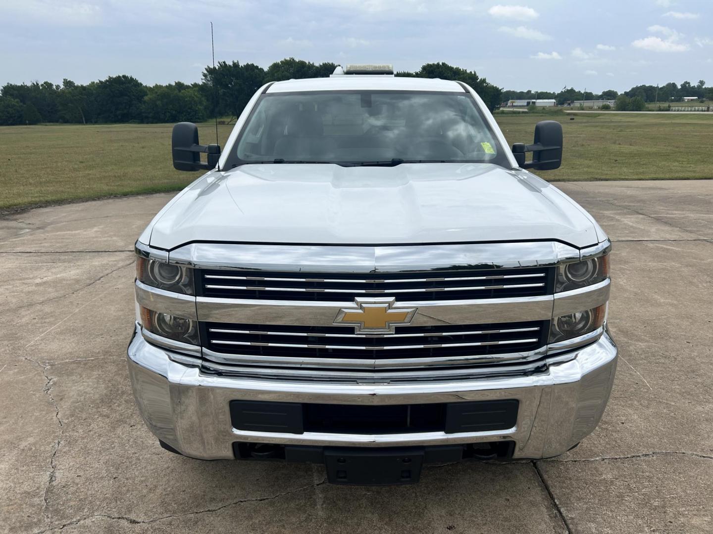2015 White /Gray Chevrolet Silverado 2500HD Work Truck Double Cab 2WD (1GC2CUEG3FZ) with an 6.0L V8 OHV 16V FFV engine, 6-Speed Automatic transmission, located at 17760 Hwy 62, Morris, OK, 74445, (918) 733-4887, 35.609104, -95.877060 - 2015 CHEVY SILVERADO 2500 HD HAS THE 6.0L V8 AND IS 2WD. IT FEATURES POWER LOCKS, POWER WINDOWS, MANUAL SEATS, CLOTH INTERIOR, NO BACK SEAT REMOVED FOR WORK SHELVING, AM/FM RADIO, BACKUP CAMERA, TRACTION CONTOL, TOOL BED, PIPE VICE AND HITCH. IT RUNS ON CNG (COMPRESSED NATURAL GAS) OR GASOLINE. A PR - Photo#1