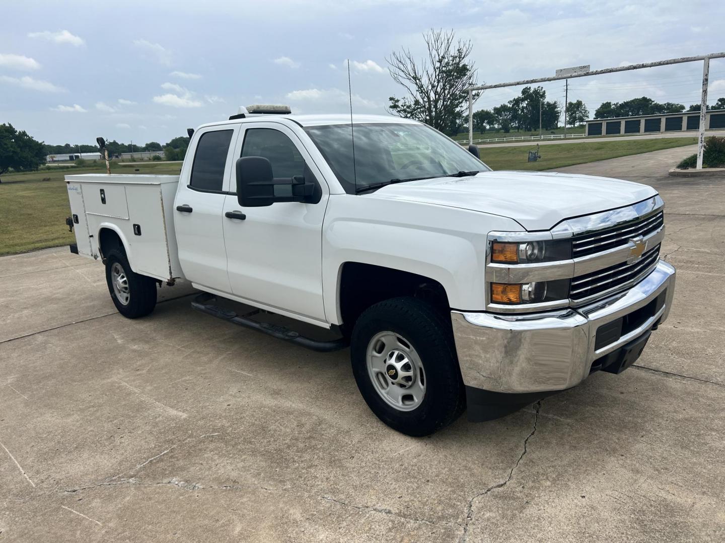 2015 White /Gray Chevrolet Silverado 2500HD Work Truck Double Cab 2WD (1GC2CUEG3FZ) with an 6.0L V8 OHV 16V FFV engine, 6-Speed Automatic transmission, located at 17760 Hwy 62, Morris, OK, 74445, (918) 733-4887, 35.609104, -95.877060 - 2015 CHEVY SILVERADO 2500 HD HAS THE 6.0L V8 AND IS 2WD. IT FEATURES POWER LOCKS, POWER WINDOWS, MANUAL SEATS, CLOTH INTERIOR, NO BACK SEAT REMOVED FOR WORK SHELVING, AM/FM RADIO, BACKUP CAMERA, TRACTION CONTOL, TOOL BED, PIPE VICE AND HITCH. IT RUNS ON CNG (COMPRESSED NATURAL GAS) OR GASOLINE. A PR - Photo#2
