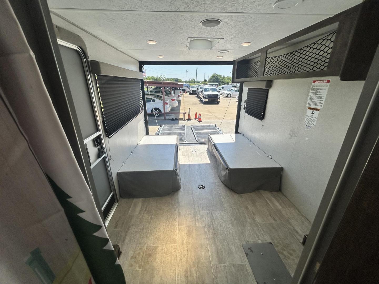 2020 WHITE Forest River OZARK TRAIL 2700THX 2700THX (4X4TZKC27LY) , located at 17760 Hwy 62, Morris, OK, 74445, 35.609104, -95.877060 - CAMPING SEASON IS HERE CHECK OUT THIS 2020 FOREST RIVER OZARK TRAIL 2700THX TOY HAULER 31FT OVERALL WITH 15FT POWER AWNING. IN THE FRONT IS THE QUEEN SIZE BED WITH STORAGE UNDER THE BED, OVERHEAD CABINET, AND WARDROBE CLOSET. IN THE LIVING AND KITCHEN AREA IS A U-SHAPED DINETTE THAT FOLDS DOWN FOR A - Photo#24