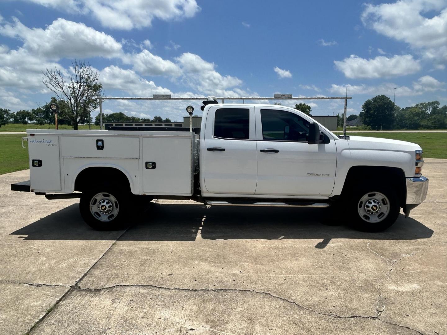 2017 WHITE /Gray Chevrolet Silverado 2500HD Work Truck Double Cab 2WD (1GC2CUEG1HZ) with an 6.0L V8 OHV 16V FFV engine, 6A transmission, located at 17760 Hwy 62, Morris, OK, 74445, (918) 733-4887, 35.609104, -95.877060 - 2017 CHEVY SILVERADO 2500 HD HAS THE 6.0L V8 AND IS 2WD. IT FEATURES POWER LOCKS, POWER WINDOWS, MANUAL SEATS, LEATHER INTERIOR, NO BACK SEAT REMOVED FOR WORK SHELVING, AM/FM RADIO, BACKUP CAMERA, TRACTION CONTOL, TRAILER BRAKES, TOOL BED, AND HITCH. IT RUNS ON CNG (COMPRESSED NATURAL GAS) A PREMIE - Photo#2