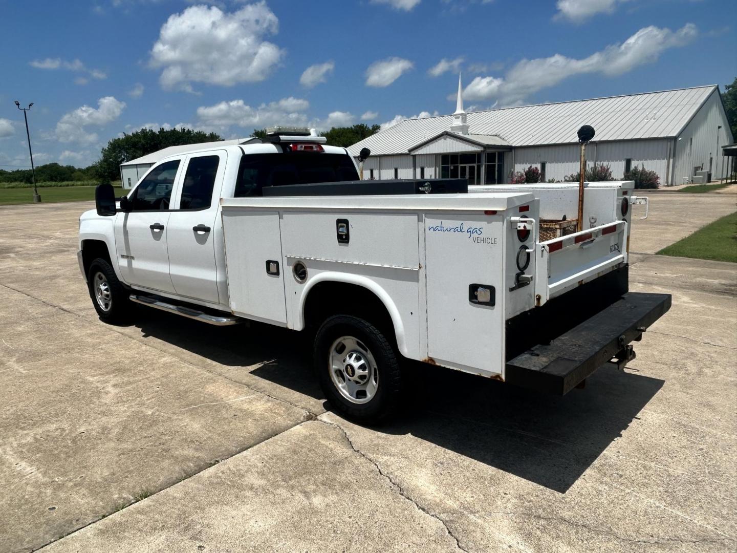 2017 WHITE /Gray Chevrolet Silverado 2500HD Work Truck Double Cab 2WD (1GC2CUEG1HZ) with an 6.0L V8 OHV 16V FFV engine, 6A transmission, located at 17760 Hwy 62, Morris, OK, 74445, (918) 733-4887, 35.609104, -95.877060 - 2017 CHEVY SILVERADO 2500 HD HAS THE 6.0L V8 AND IS 2WD. IT FEATURES POWER LOCKS, POWER WINDOWS, MANUAL SEATS, LEATHER INTERIOR, NO BACK SEAT REMOVED FOR WORK SHELVING, AM/FM RADIO, BACKUP CAMERA, TRACTION CONTOL, TRAILER BRAKES, TOOL BED, AND HITCH. IT RUNS ON CNG (COMPRESSED NATURAL GAS) A PREMIE - Photo#5