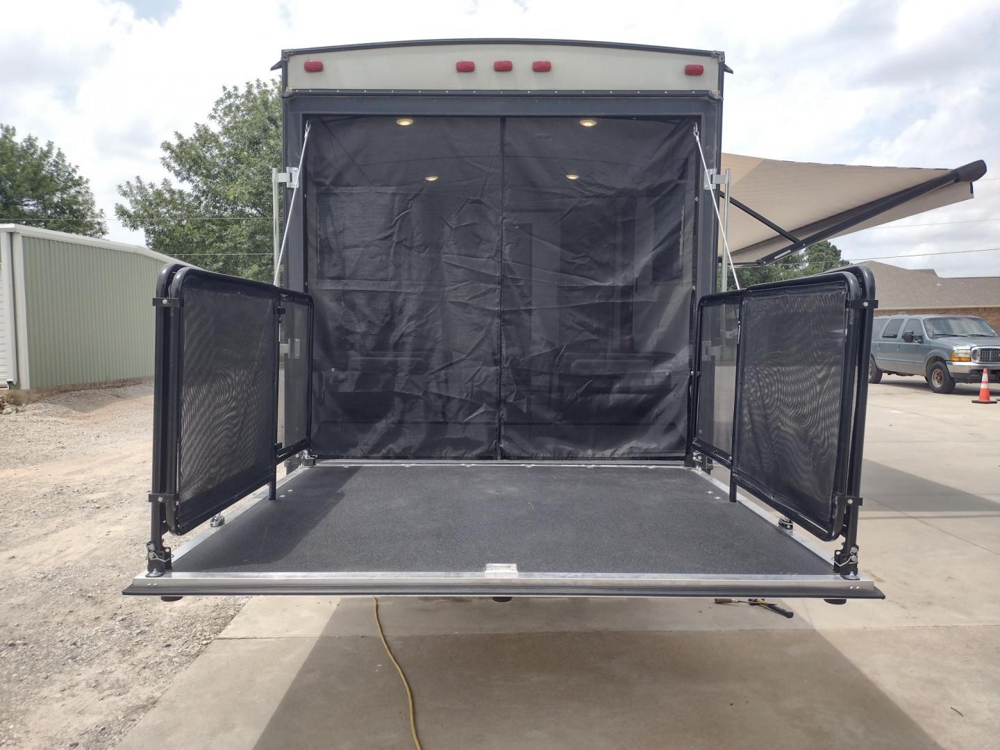 2021 WHITE/BLACK /Gray Keystone SPRINGDALE SG32TH SG32TH (4YDT32T20M3) , located at 17760 Hwy 62, Morris, OK, 74445, 35.609104, -95.877060 - YOUR ADVENTURE AWAITS CHECK OUT THIS 2021 KEYSTONE SPRINGDALE TAILGATOR TOY HAULER SG32TH 36FT OVERALL WITH A 21FT POWER AWNING. IN THE FRONT IS THE BEDROOM WITH A QUEEN SIZE BED, OVERHEAD DOUBLE SHELF, 2 WARDROBE CLOSETS, STORAGE NEXT TO THE BED AND UNDER. IN THE LIVING AND KITCHEN AREA IS THE ENTE - Photo#16