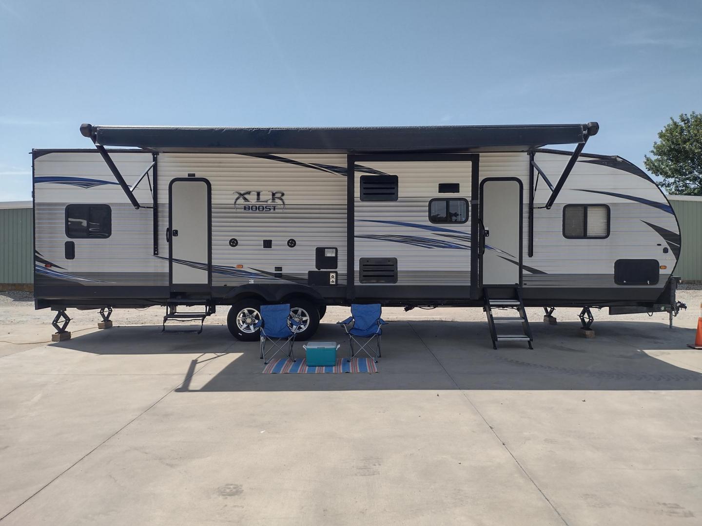 2018 Silver /Gray Forest River XLR Toy Hauler 31QB (5ZT2XLWB1J1) , located at 17760 Hwy 62, Morris, OK, 74445, 35.609104, -95.877060 - CHECK OUT THIS 2018 FOREST RIVER XLR BOOST 31QB 39FT OVERALL WITH 15FT POWER AWNING. IN THE FRONT IS THE BEDROOM WITH QUEEN SIZE BED, OVERHEAD CABINETS, 2 WARDROBE CLOSETS, AND STORAGE UNDER THE BED. CONNECTED TO THE BEDROOM IS A FULL BATH WITH VANITY SINK, MEDICINE CABINET, AND STANDING SHOWER. IN - Photo#1