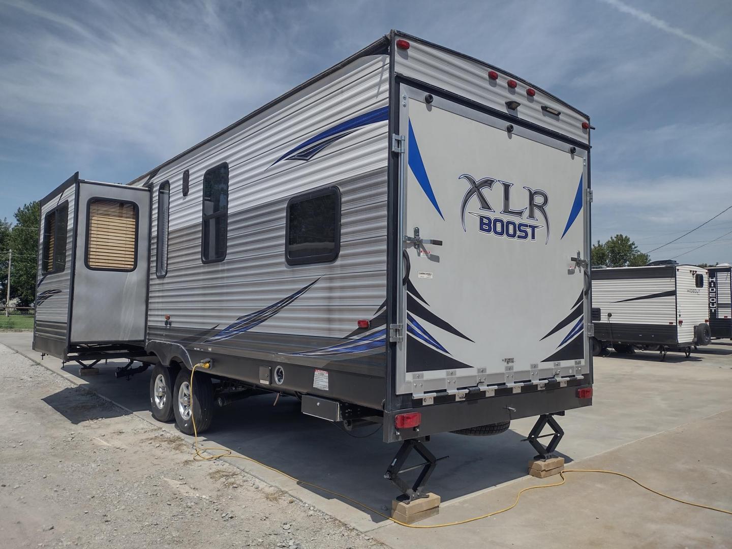 2018 Silver /Gray Forest River XLR Toy Hauler 31QB (5ZT2XLWB1J1) , located at 17760 Hwy 62, Morris, OK, 74445, 35.609104, -95.877060 - CHECK OUT THIS 2018 FOREST RIVER XLR BOOST 31QB 39FT OVERALL WITH 15FT POWER AWNING. IN THE FRONT IS THE BEDROOM WITH QUEEN SIZE BED, OVERHEAD CABINETS, 2 WARDROBE CLOSETS, AND STORAGE UNDER THE BED. CONNECTED TO THE BEDROOM IS A FULL BATH WITH VANITY SINK, MEDICINE CABINET, AND STANDING SHOWER. IN - Photo#3