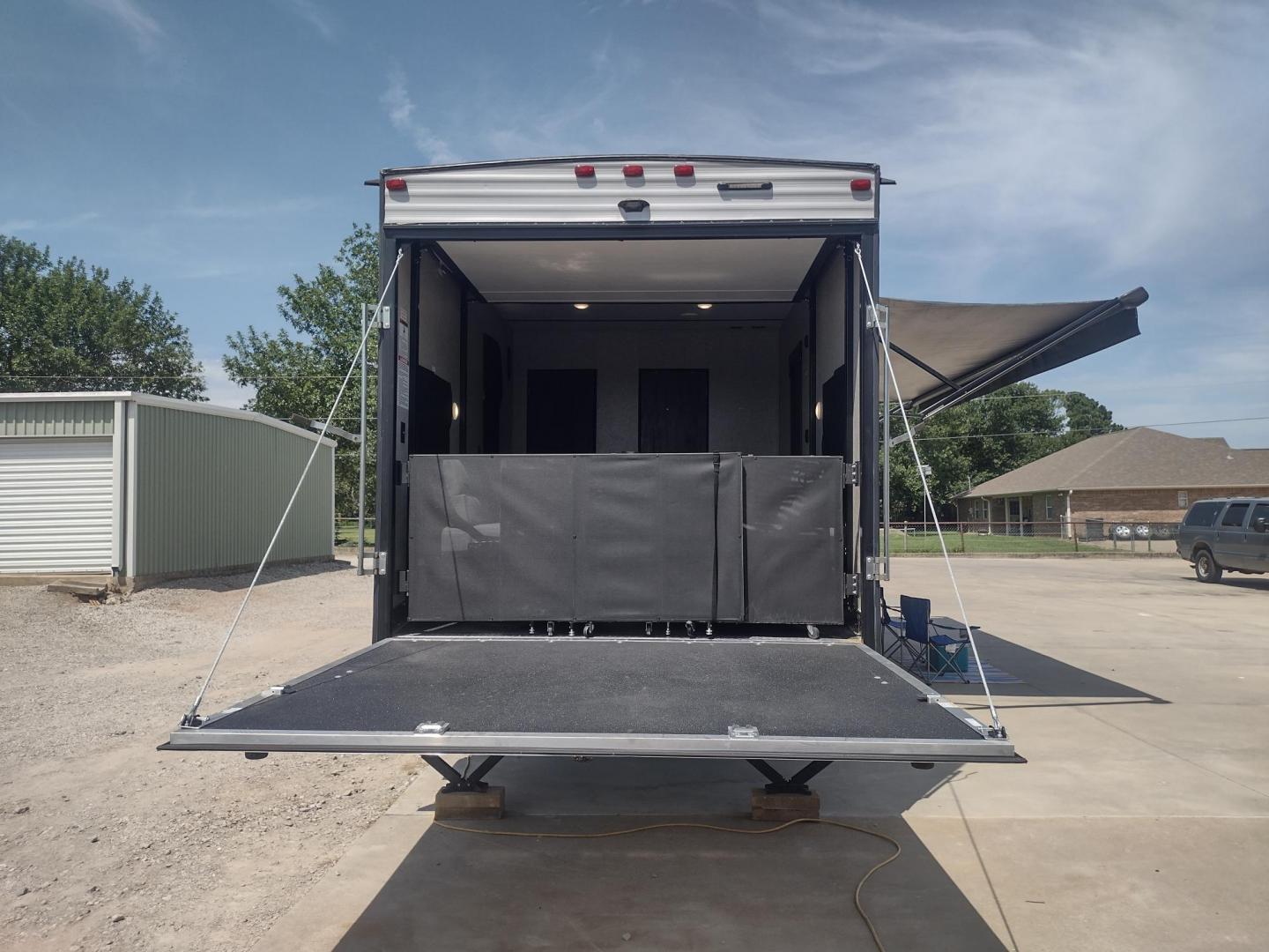 2018 Silver /Gray Forest River XLR Toy Hauler 31QB (5ZT2XLWB1J1) , located at 17760 Hwy 62, Morris, OK, 74445, 35.609104, -95.877060 - CHECK OUT THIS 2018 FOREST RIVER XLR BOOST 31QB 39FT OVERALL WITH 15FT POWER AWNING. IN THE FRONT IS THE BEDROOM WITH QUEEN SIZE BED, OVERHEAD CABINETS, 2 WARDROBE CLOSETS, AND STORAGE UNDER THE BED. CONNECTED TO THE BEDROOM IS A FULL BATH WITH VANITY SINK, MEDICINE CABINET, AND STANDING SHOWER. IN - Photo#11