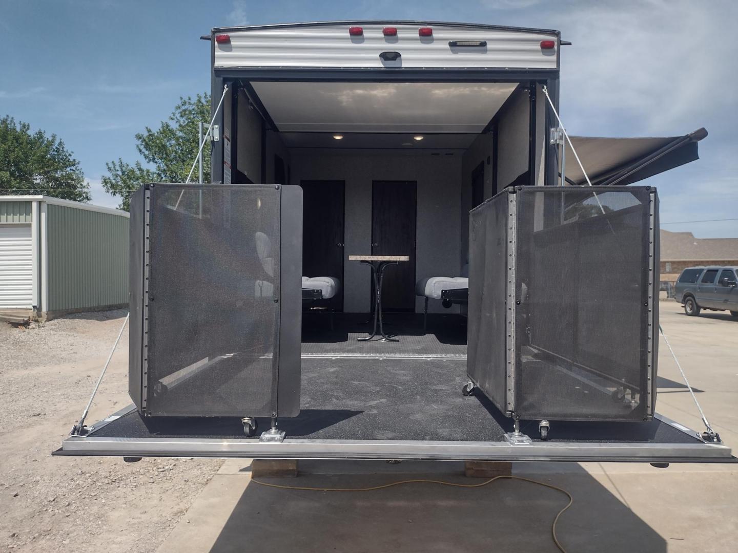 2018 Silver /Gray Forest River XLR Toy Hauler 31QB (5ZT2XLWB1J1) , located at 17760 Hwy 62, Morris, OK, 74445, 35.609104, -95.877060 - CHECK OUT THIS 2018 FOREST RIVER XLR BOOST 31QB 39FT OVERALL WITH 15FT POWER AWNING. IN THE FRONT IS THE BEDROOM WITH QUEEN SIZE BED, OVERHEAD CABINETS, 2 WARDROBE CLOSETS, AND STORAGE UNDER THE BED. CONNECTED TO THE BEDROOM IS A FULL BATH WITH VANITY SINK, MEDICINE CABINET, AND STANDING SHOWER. IN - Photo#13