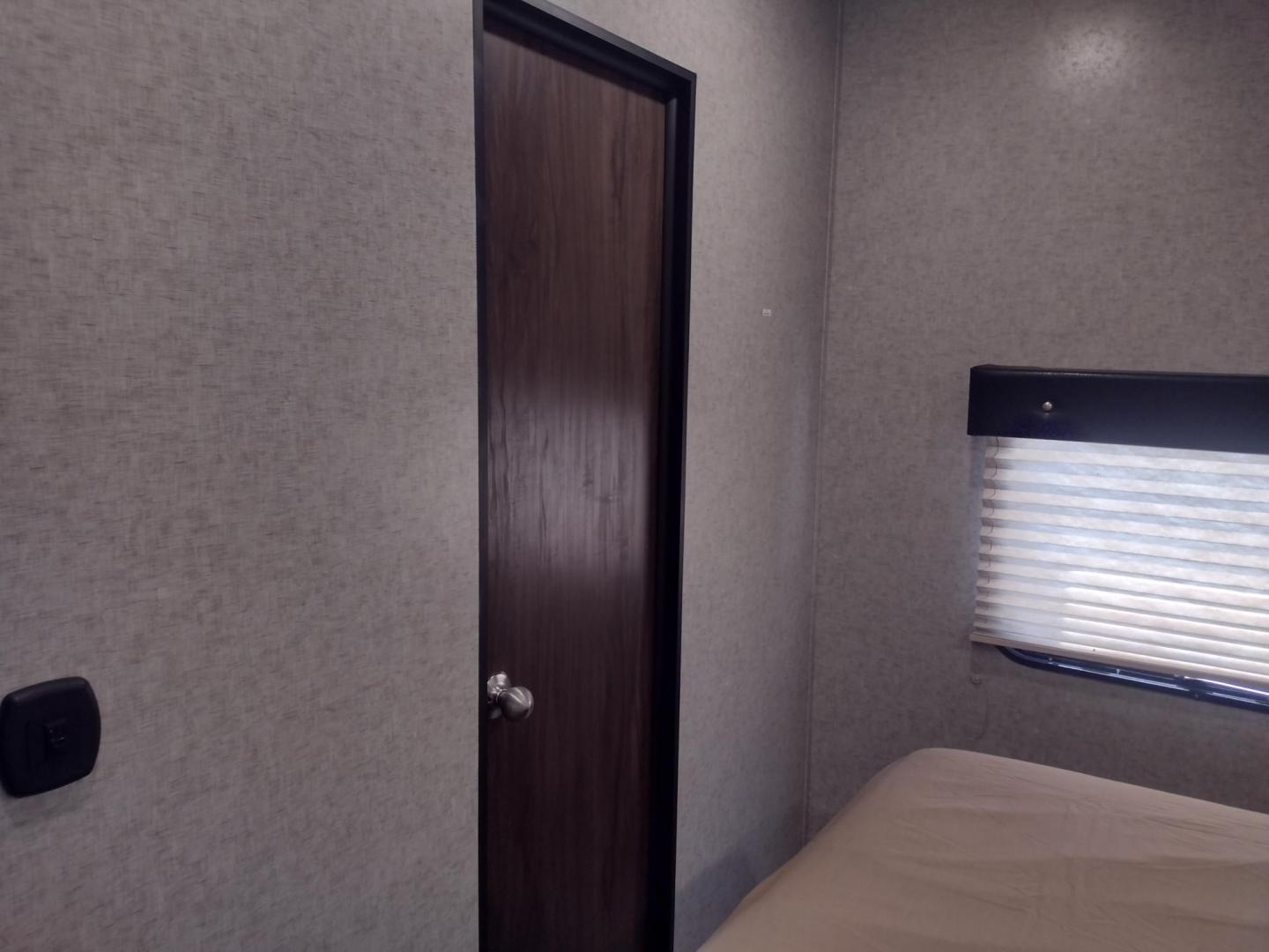 2018 Silver /Gray Forest River XLR Toy Hauler 31QB (5ZT2XLWB1J1) , located at 17760 Hwy 62, Morris, OK, 74445, 35.609104, -95.877060 - CHECK OUT THIS 2018 FOREST RIVER XLR BOOST 31QB 39FT OVERALL WITH 15FT POWER AWNING. IN THE FRONT IS THE BEDROOM WITH QUEEN SIZE BED, OVERHEAD CABINETS, 2 WARDROBE CLOSETS, AND STORAGE UNDER THE BED. CONNECTED TO THE BEDROOM IS A FULL BATH WITH VANITY SINK, MEDICINE CABINET, AND STANDING SHOWER. IN - Photo#20