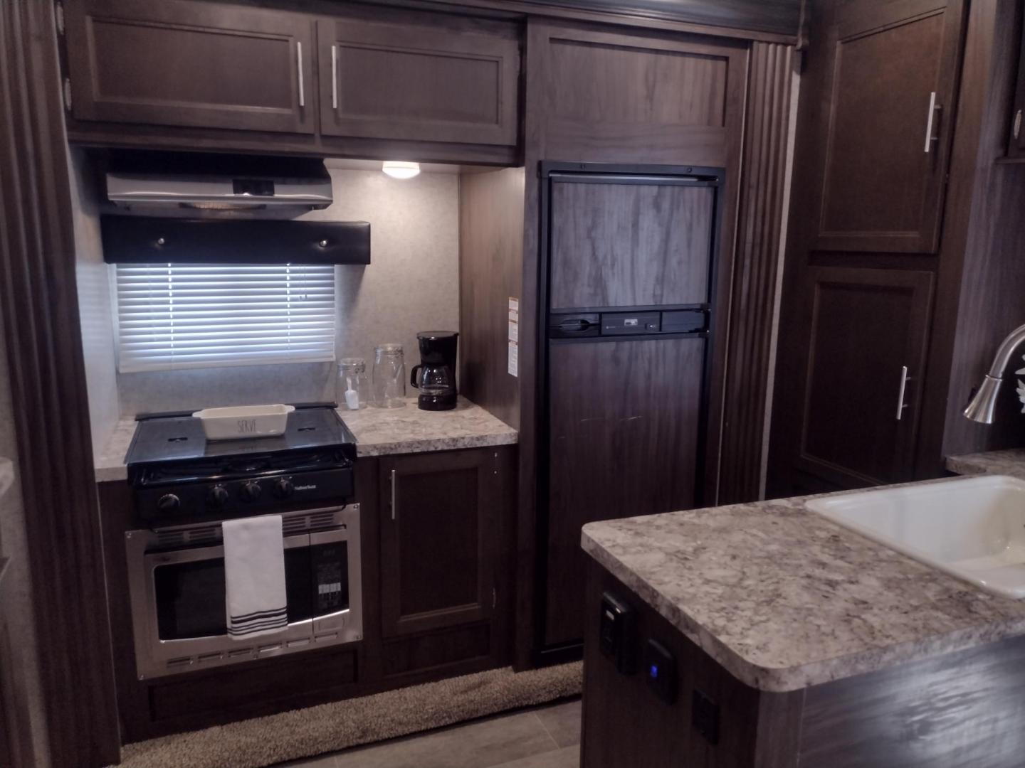 2018 Silver /Gray Forest River XLR Toy Hauler 31QB (5ZT2XLWB1J1) , located at 17760 Hwy 62, Morris, OK, 74445, 35.609104, -95.877060 - CHECK OUT THIS 2018 FOREST RIVER XLR BOOST 31QB 39FT OVERALL WITH 15FT POWER AWNING. IN THE FRONT IS THE BEDROOM WITH QUEEN SIZE BED, OVERHEAD CABINETS, 2 WARDROBE CLOSETS, AND STORAGE UNDER THE BED. CONNECTED TO THE BEDROOM IS A FULL BATH WITH VANITY SINK, MEDICINE CABINET, AND STANDING SHOWER. IN - Photo#24