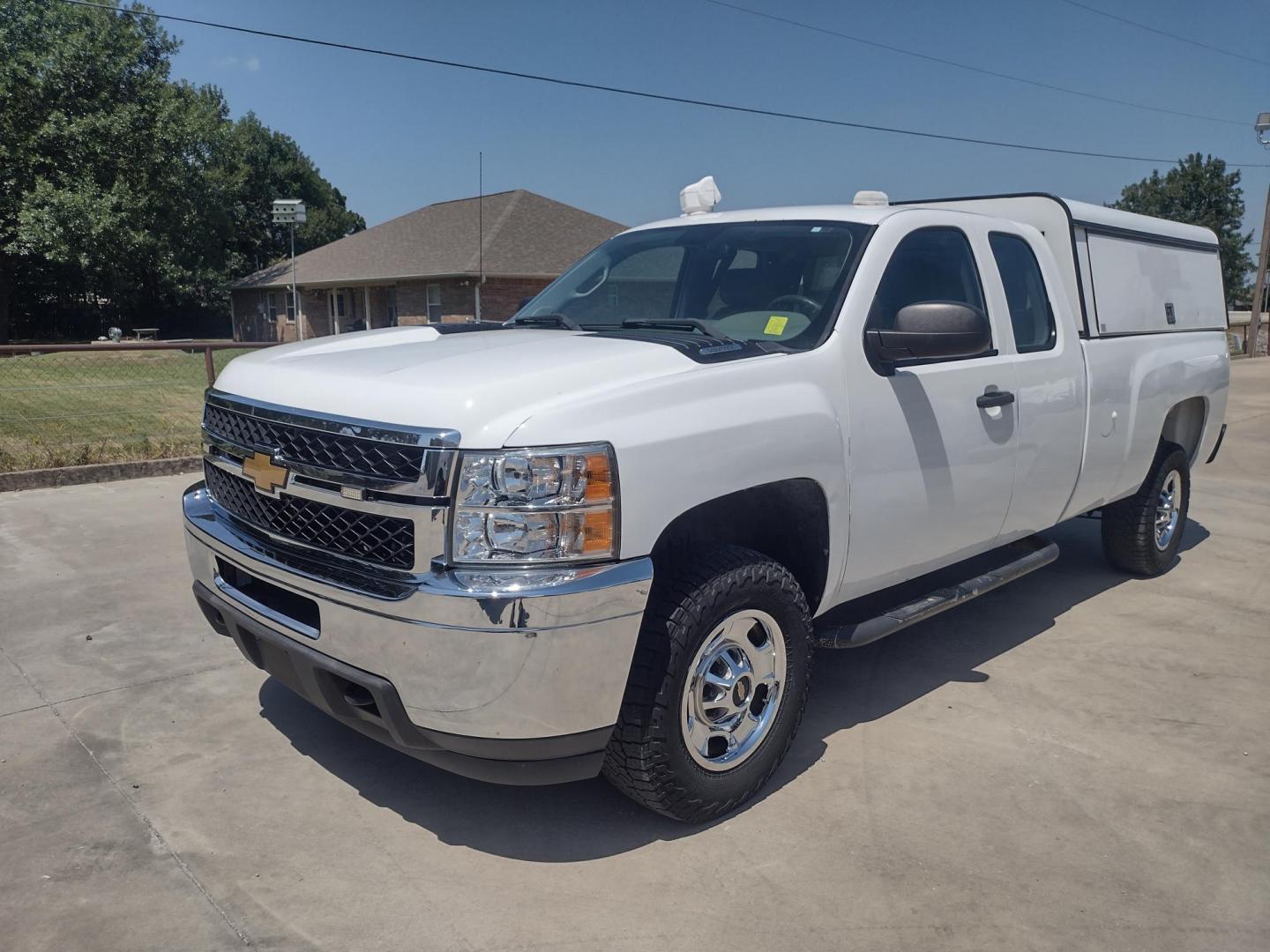 2013 WHITE /Gray Chevrolet Silverado 2500HD Work Truck Ext. Cab 4WD (1GC2KVCB1DZ) with an 6.0L V8 OHV 16V CNG engine, 6-Speed Automatic transmission, located at 17760 Hwy 62, Morris, OK, 74445, (918) 733-4887, 35.609104, -95.877060 - 2013 CHEVY SILVERADO 4WD WITH THE 6.0L V8 ENGINE. THIS TRUCK FEATURES MANUAL WINDOWS, MANUAL LOCKS, MANUAL MIRRORS, MANUAL SEATS, LEATHER INTERIOR, CRUSIE CONTROL, TRACTION CONTROL, AND AM/FM RADIO. CAMPER SHELL WITH SHELVES AND CARGO SLIDER, DIMENSIONS INVERTER AND TRAILER HITCH. ONLY 184,332 MILE - Photo#0