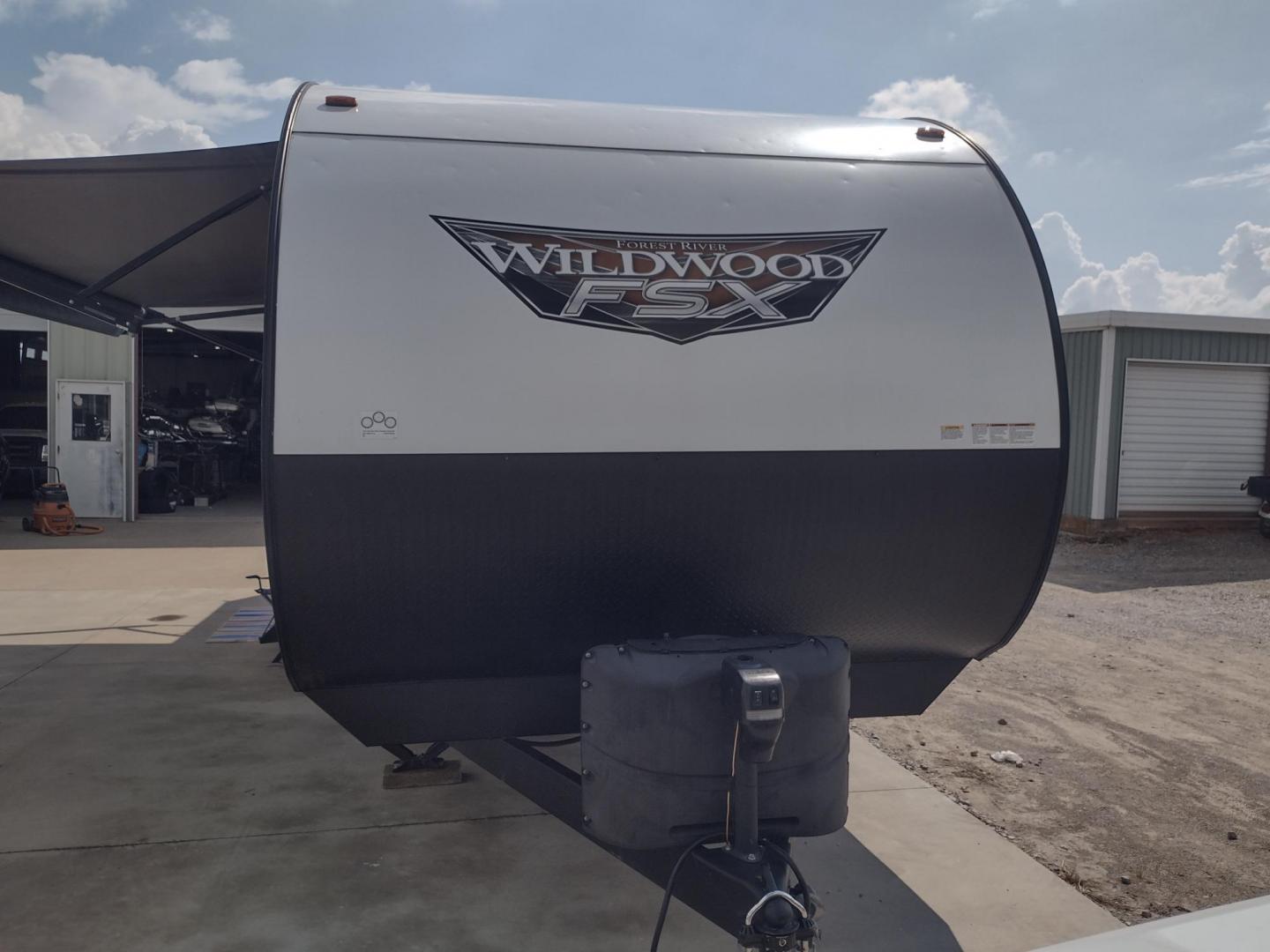 2022 WHITE /Gray Forest River WILDWOOD 270RTK 270RTK (4X4TWDC28NY) , located at 17760 Hwy 62, Morris, OK, 74445, 35.609104, -95.877060 - CHECK OUT THIS 2022 FOREST RIVER WILDWOOD 270RTK 32FT OVERALL WITH 18FT POWER AWNING. IN THE LIVING AND KITCHEN AREA IS A BOOTH STYLE DINETTE THAT FOLD DOWN FOR ADDITIONAL SLEEPING OR FOLDS UP FOR CARGO SPACE, ELECTRIC FIRE PLACE WITH CABINET SPACE, 3 BURNER STOVE (NO OVEN), FARM STYLE SINK, MICROWA - Photo#7