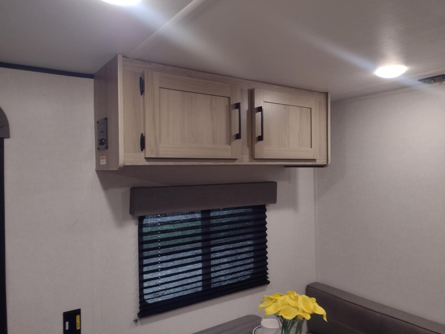 2025 White /TAN Keystone COLEMAN 17R 17R (4YDTCMG19SM) , located at 17760 Hwy 62, Morris, OK, 74445, 35.609104, -95.877060 - GRAB IT WHILE YOU CAN CHECK OUT THIS 2025 KEYSTONE COLEMAN 17R 21FT OVERALL WITH A 8FT POWER AWNING. IN THE FRONT IS A FULL SIZE BED WITH STORAGE UNDER THE BED, OVERHEAD SHELF, WARDROBE CLOSET, AND AC UNIT. IN THE LIVING AND KITCHEN AREA IS A 2 BURNER STOVE (NO OVEN), SINGLE SINK, OVERHEAD CABINETS, - Photo#21