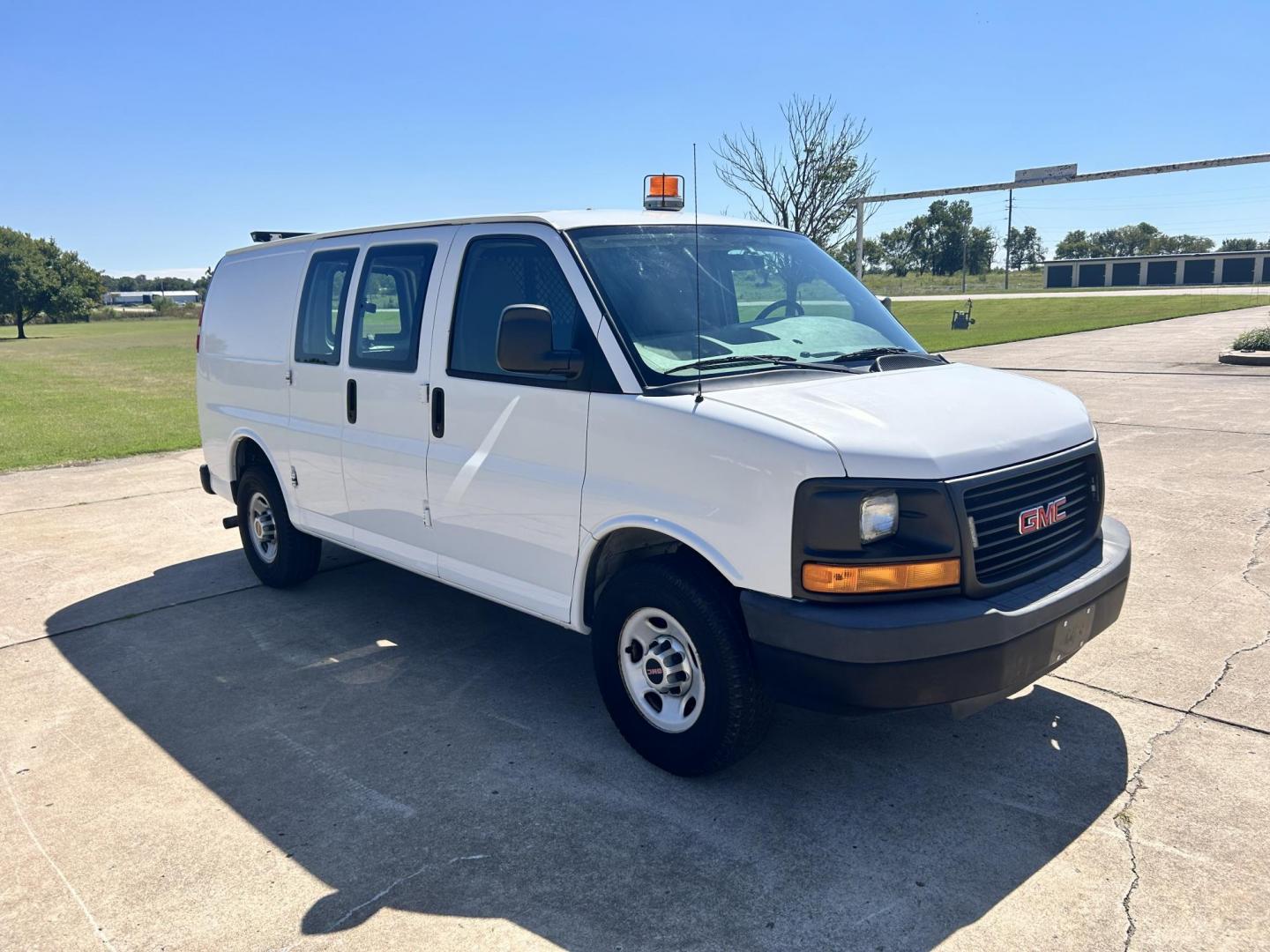 2012 White /Gray GMC Savana Cargo (1GTW7FFB5C1) with an 6.0L V8 OHV 16V CNG engine, 6-Speed Automatic transmission, located at 17760 Hwy 62, Morris, OK, 74445, (918) 733-4887, 35.609104, -95.877060 - 2012 GMC SAVANA CARGO VAN RWD WITH THE 6.0L V8 ENGINE DEDICATED CNG ONLY RUNS ON COMPRESSED NATURAL GAS. IT FEATURES POWER LOCKS, POWER WINDOWS, POWER MIRRORS, CLOTH INTERIOR, MANUAL SEATS, CRUISE CONTROL, TRACTION CONTROL, HAUL MODE, AM/FM RADIO, SPLIT SWING-OUT SIDE DOORS AND BACK DOORS, AND TIRE - Photo#2
