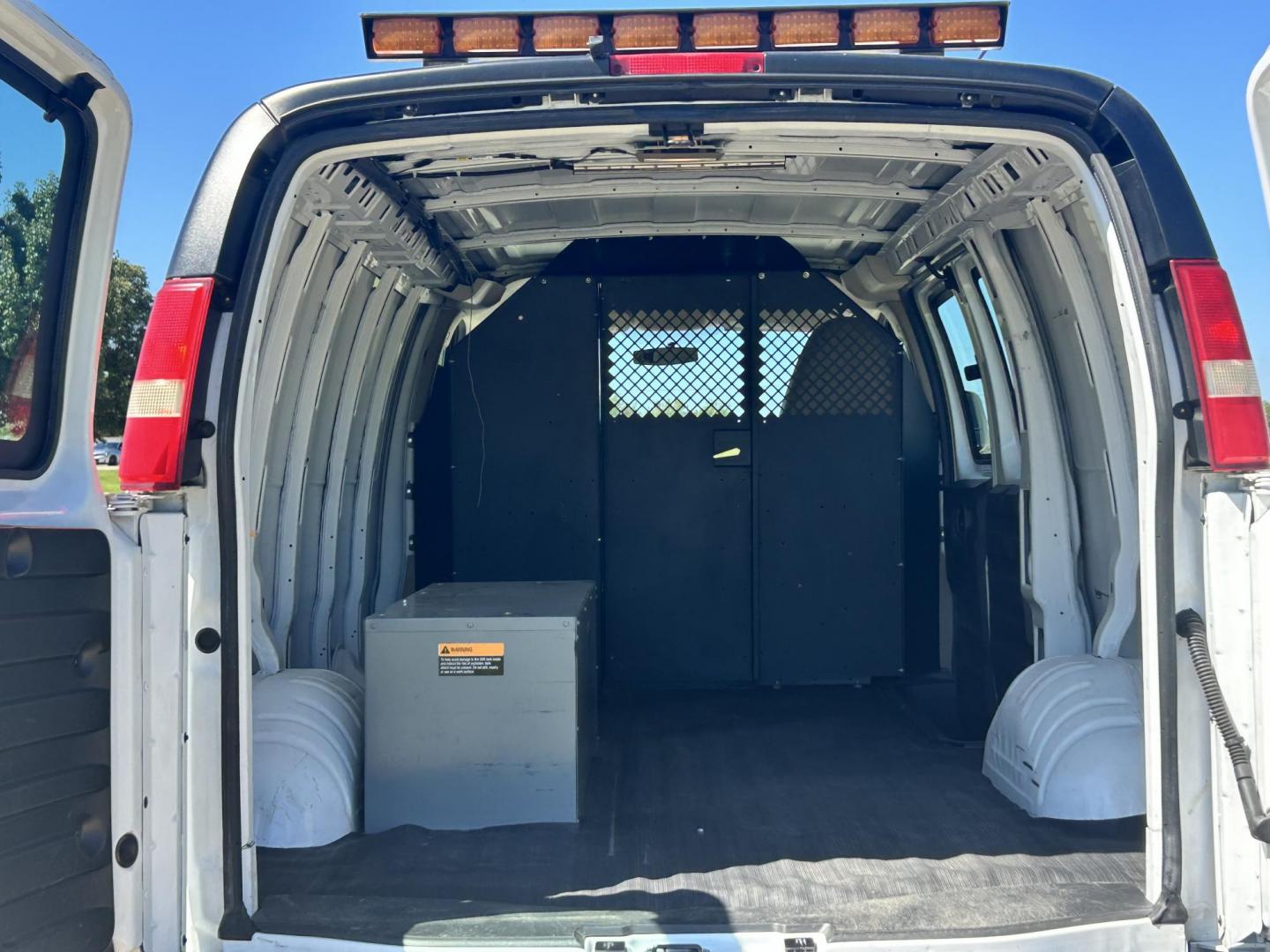 2012 White /Gray GMC Savana Cargo (1GTW7FFB5C1) with an 6.0L V8 OHV 16V CNG engine, 6-Speed Automatic transmission, located at 17760 Hwy 62, Morris, OK, 74445, (918) 733-4887, 35.609104, -95.877060 - 2012 GMC SAVANA CARGO VAN RWD WITH THE 6.0L V8 ENGINE DEDICATED CNG ONLY RUNS ON COMPRESSED NATURAL GAS. IT FEATURES POWER LOCKS, POWER WINDOWS, POWER MIRRORS, CLOTH INTERIOR, MANUAL SEATS, CRUISE CONTROL, TRACTION CONTROL, HAUL MODE, AM/FM RADIO, SPLIT SWING-OUT SIDE DOORS AND BACK DOORS, AND TIRE - Photo#14