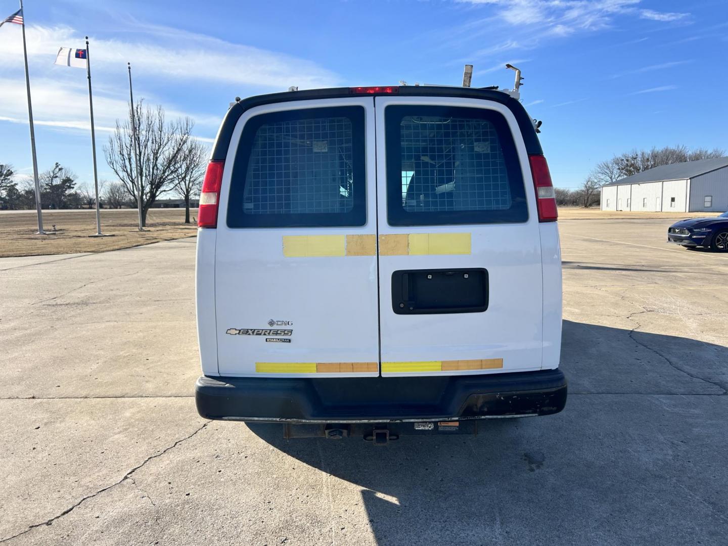 2013 White /Gray Chevrolet Express 2500 Cargo (1GCWGFCB5D1) with an 6.0L V8 OHV 16V FFV engine, 6-Speed Automatic transmission, located at 17760 Hwy 62, Morris, OK, 74445, (918) 733-4887, 35.609104, -95.877060 - 2013 CHEVROLET EXPRESS DEDICATED CNG ONLY RUNS ON COMPRESSED NATURAL GAS RWD 6.0L V8 ENGINE. FEATURING POWER LOCKS, MANUAL WINDOWS, MANUAL MIRRORS, MANUAL SEATS, AM/FM STEREO, LEATHER SEATS, BACKUP CAMERA, TRACTION CONTROL, LOCKING METAL CONSOLE, STEEL SHELVES, SPLIT SWING-OUT RIGHT DOORS, AND TOW P - Photo#5