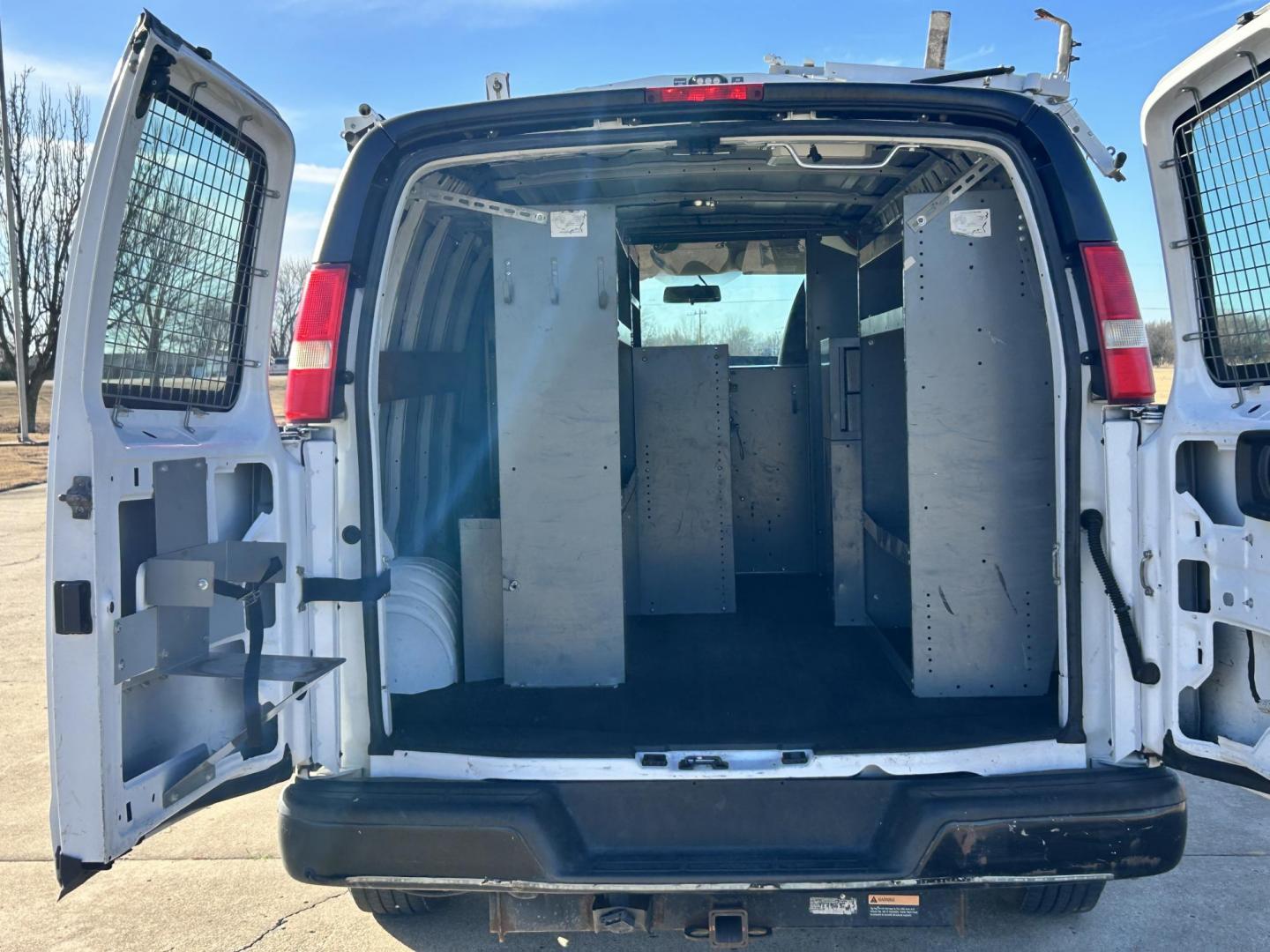 2013 White /Gray Chevrolet Express 2500 Cargo (1GCWGFCB5D1) with an 6.0L V8 OHV 16V FFV engine, 6-Speed Automatic transmission, located at 17760 Hwy 62, Morris, OK, 74445, (918) 733-4887, 35.609104, -95.877060 - 2013 CHEVROLET EXPRESS DEDICATED CNG ONLY RUNS ON COMPRESSED NATURAL GAS RWD 6.0L V8 ENGINE. FEATURING POWER LOCKS, MANUAL WINDOWS, MANUAL MIRRORS, MANUAL SEATS, AM/FM STEREO, LEATHER SEATS, BACKUP CAMERA, TRACTION CONTROL, LOCKING METAL CONSOLE, STEEL SHELVES, SPLIT SWING-OUT RIGHT DOORS, AND TOW P - Photo#15