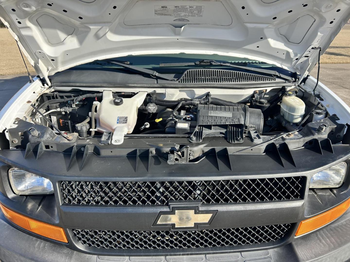 2013 White /Gray Chevrolet Express 2500 Cargo (1GCWGFCB5D1) with an 6.0L V8 OHV 16V FFV engine, 6-Speed Automatic transmission, located at 17760 Hwy 62, Morris, OK, 74445, (918) 733-4887, 35.609104, -95.877060 - 2013 CHEVROLET EXPRESS DEDICATED CNG ONLY RUNS ON COMPRESSED NATURAL GAS RWD 6.0L V8 ENGINE. FEATURING POWER LOCKS, MANUAL WINDOWS, MANUAL MIRRORS, MANUAL SEATS, AM/FM STEREO, LEATHER SEATS, BACKUP CAMERA, TRACTION CONTROL, LOCKING METAL CONSOLE, STEEL SHELVES, SPLIT SWING-OUT RIGHT DOORS, AND TOW P - Photo#21