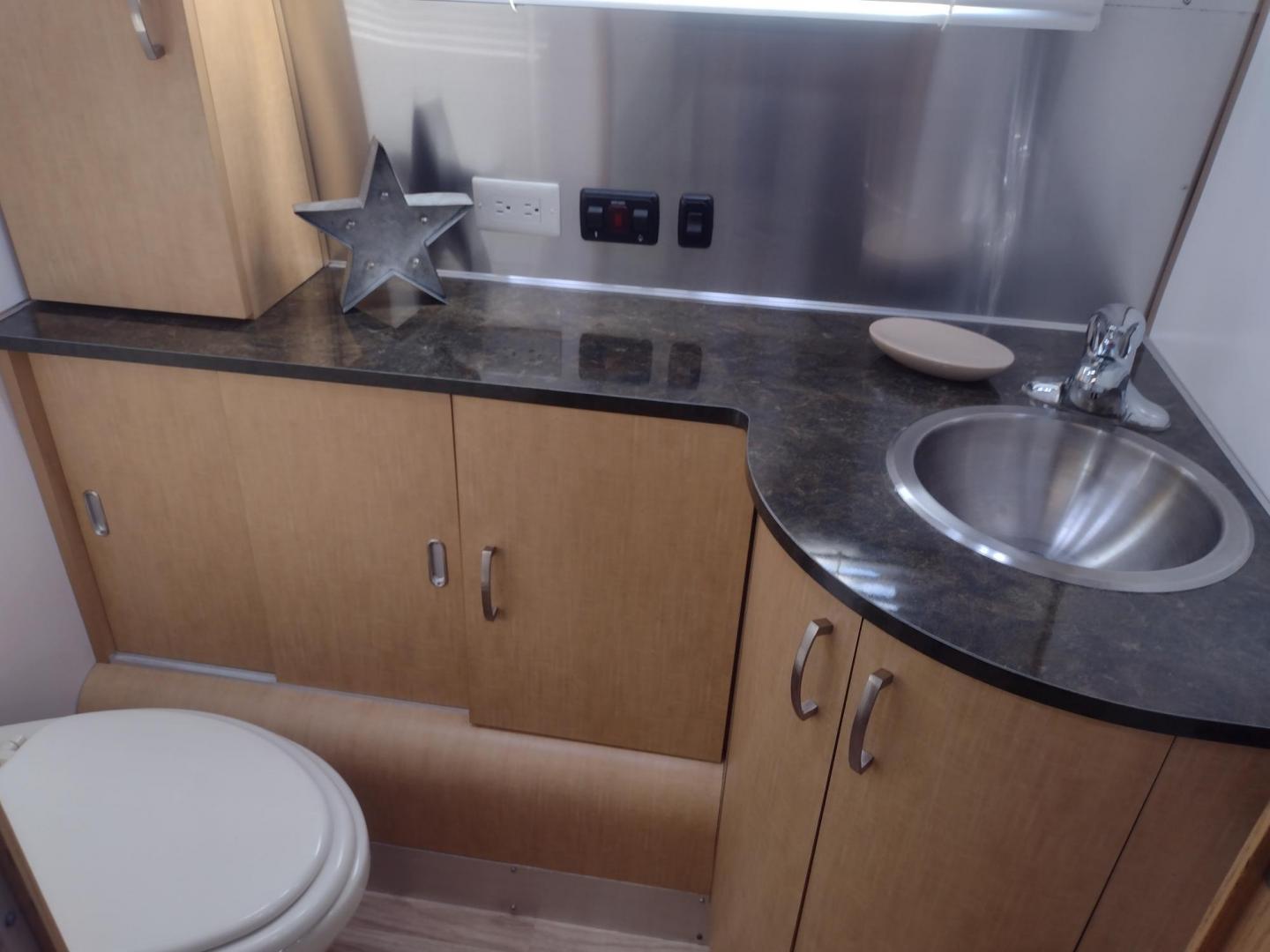 2014 Silver /TAN Airstream FLYING CLOUD 30 30 (1STJ9YP22EJ) , located at 17760 Hwy 62, Morris, OK, 74445, 35.609104, -95.877060 - HAVE YOU EVER WANTED TO BECOME PART OF THE AIRSTREAM FAMILY? WELL HERE IS YOUR CHANCE, CHECK OUT THIS 2014 AIRSTREAM FLYING CLOUD 30 31FT OVERALL WITH A 21FT MANUAL AWNING. ***REBUILT TITLE DUE TO HAIL DAMAGE*** IN THE LIVING AND KITCHEN AREA IS A LEATHER SOFA THAT FOLDS DOWN FOR ADDITIONAL SLEEPING - Photo#41