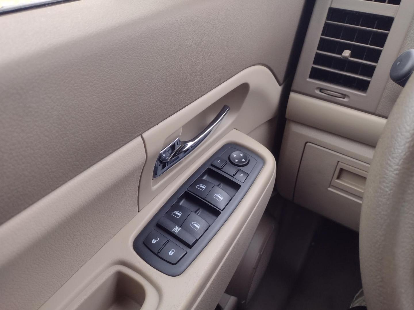 2009 Silver /TAN Jeep Liberty Sport 4WD (1J8GN28K99W) with an 3.7L V6 SOHC 12V engine, 4-Speed Automatic Overdrive transmission, located at 17760 Hwy 62, Morris, OK, 74445, (918) 733-4887, 35.609104, -95.877060 - Photo#9