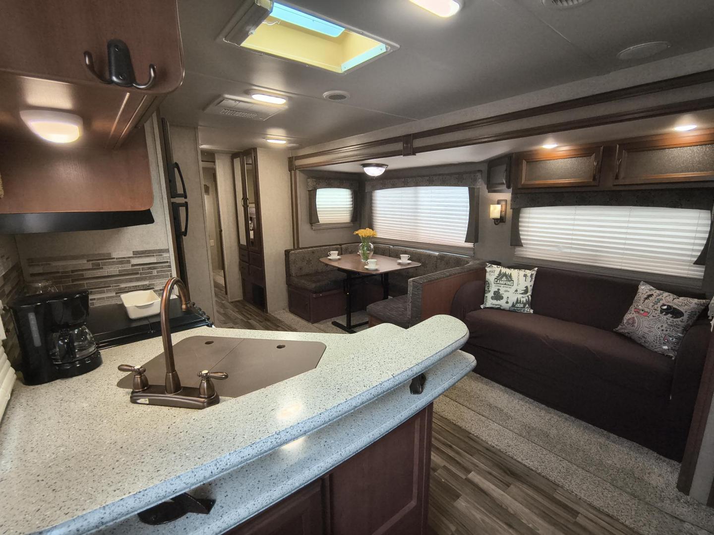 2015 White /BROWN Forest River PUMA 31BHSS 31BHSS (4X4TPUG23FP) , located at 17760 Hwy 62, Morris, OK, 74445, 35.609104, -95.877060 - CAMPING SEASON IS RIGHT AROUND THE CORNER SO CHECK OUT THIS 2015 FOREST RIVER PUMA 31BHSS 34.5FT OVERALL WITH 15FT POWER AWNING. IN THE FRONT IS THE MASTER BEDROOM WITH A QUEEN SIZE BED, STORAGE UNDER THE BED, TWO WARDROBE CLOSETS, AND OVERHEAD CABINETS. IN THE LIVING AND KITCHEN AREA THERE IS A ENT - Photo#12