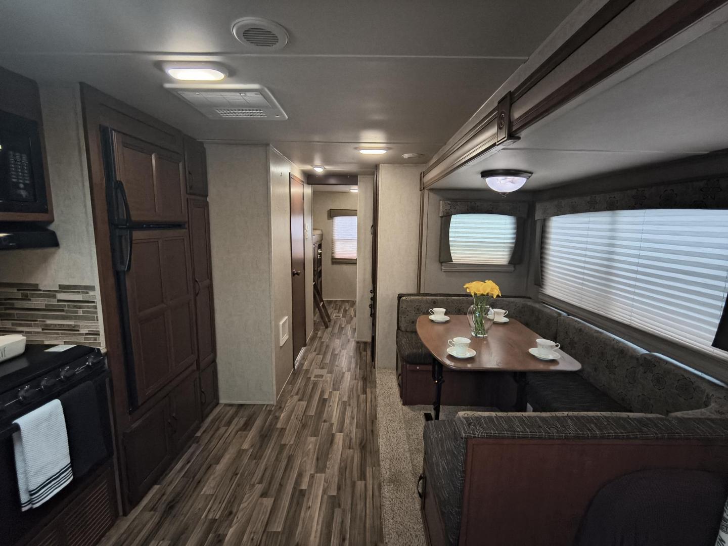 2015 White /BROWN Forest River PUMA 31BHSS 31BHSS (4X4TPUG23FP) , located at 17760 Hwy 62, Morris, OK, 74445, 35.609104, -95.877060 - CAMPING SEASON IS RIGHT AROUND THE CORNER SO CHECK OUT THIS 2015 FOREST RIVER PUMA 31BHSS 34.5FT OVERALL WITH 15FT POWER AWNING. IN THE FRONT IS THE MASTER BEDROOM WITH A QUEEN SIZE BED, STORAGE UNDER THE BED, TWO WARDROBE CLOSETS, AND OVERHEAD CABINETS. IN THE LIVING AND KITCHEN AREA THERE IS A ENT - Photo#13