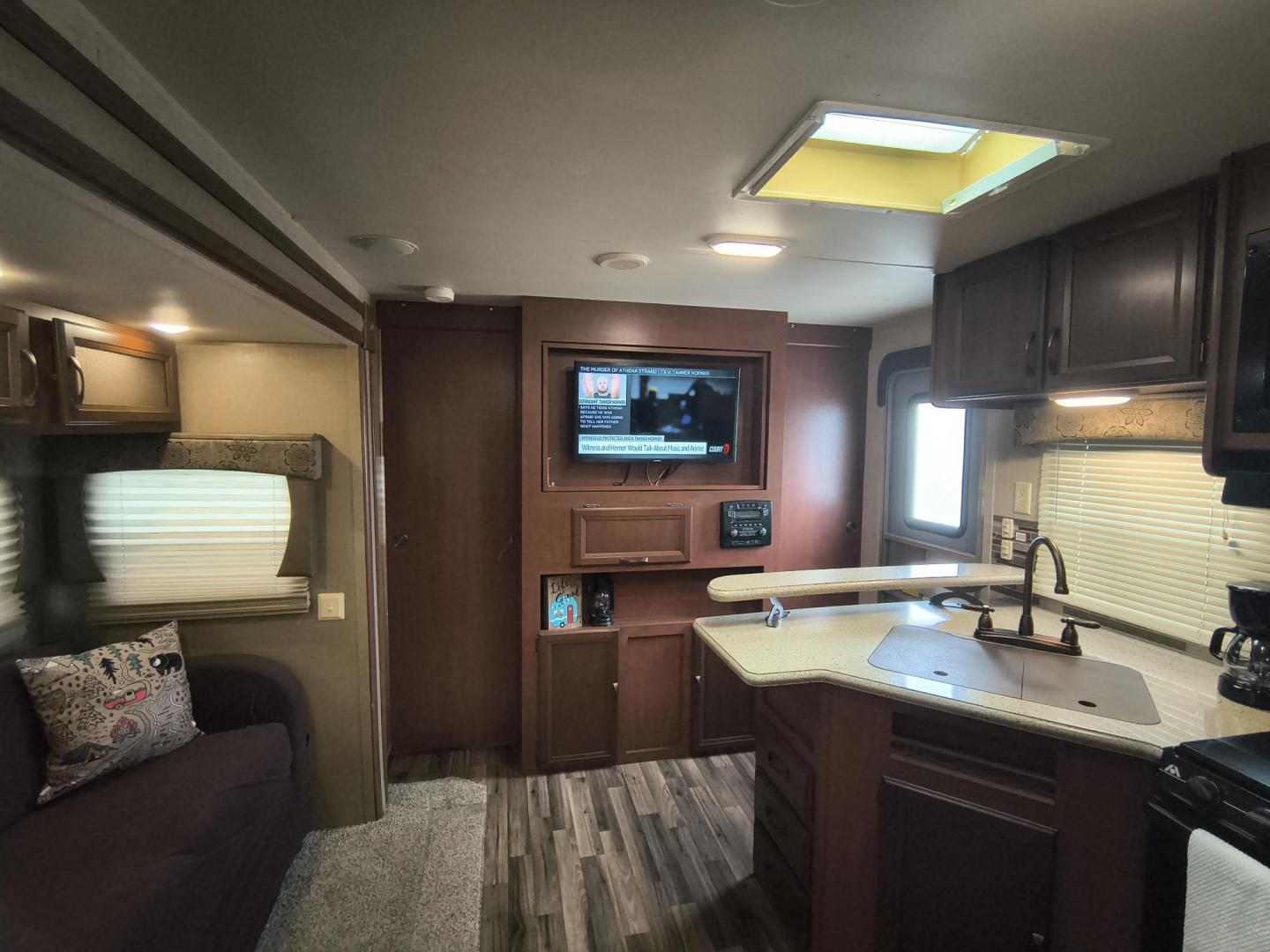 2015 White /BROWN Forest River PUMA 31BHSS 31BHSS (4X4TPUG23FP) , located at 17760 Hwy 62, Morris, OK, 74445, 35.609104, -95.877060 - CAMPING SEASON IS RIGHT AROUND THE CORNER SO CHECK OUT THIS 2015 FOREST RIVER PUMA 31BHSS 34.5FT OVERALL WITH 15FT POWER AWNING. IN THE FRONT IS THE MASTER BEDROOM WITH A QUEEN SIZE BED, STORAGE UNDER THE BED, TWO WARDROBE CLOSETS, AND OVERHEAD CABINETS. IN THE LIVING AND KITCHEN AREA THERE IS A ENT - Photo#15