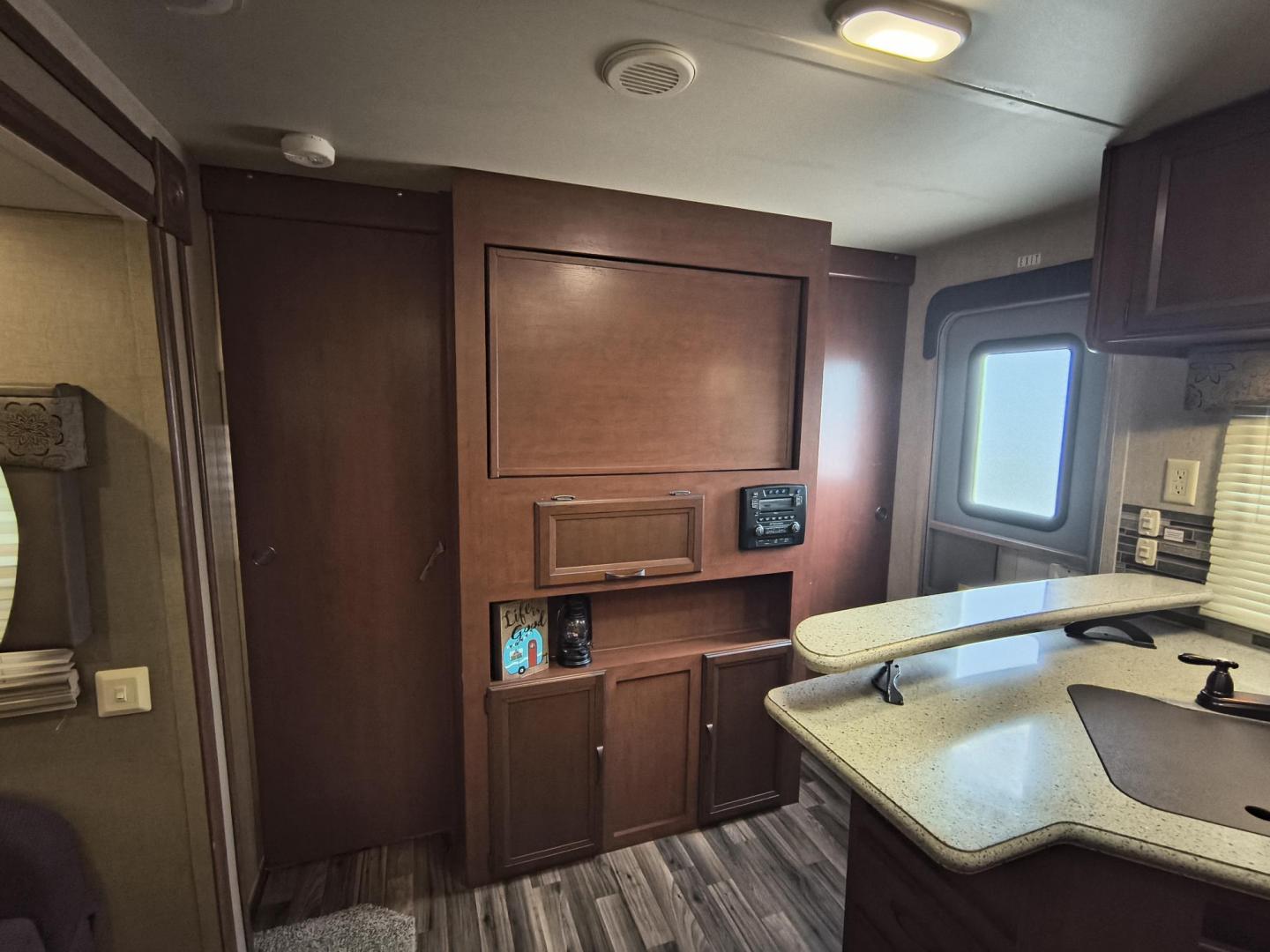 2015 White /BROWN Forest River PUMA 31BHSS 31BHSS (4X4TPUG23FP) , located at 17760 Hwy 62, Morris, OK, 74445, 35.609104, -95.877060 - CAMPING SEASON IS RIGHT AROUND THE CORNER SO CHECK OUT THIS 2015 FOREST RIVER PUMA 31BHSS 34.5FT OVERALL WITH 15FT POWER AWNING. IN THE FRONT IS THE MASTER BEDROOM WITH A QUEEN SIZE BED, STORAGE UNDER THE BED, TWO WARDROBE CLOSETS, AND OVERHEAD CABINETS. IN THE LIVING AND KITCHEN AREA THERE IS A ENT - Photo#16