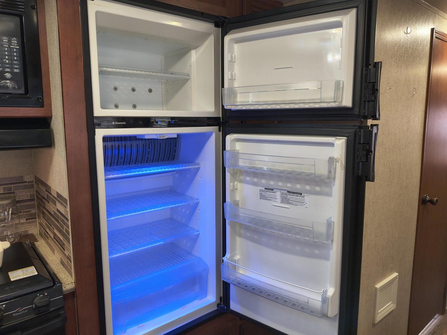 2015 White /BROWN Forest River PUMA 31BHSS 31BHSS (4X4TPUG23FP) , located at 17760 Hwy 62, Morris, OK, 74445, 35.609104, -95.877060 - CAMPING SEASON IS RIGHT AROUND THE CORNER SO CHECK OUT THIS 2015 FOREST RIVER PUMA 31BHSS 34.5FT OVERALL WITH 15FT POWER AWNING. IN THE FRONT IS THE MASTER BEDROOM WITH A QUEEN SIZE BED, STORAGE UNDER THE BED, TWO WARDROBE CLOSETS, AND OVERHEAD CABINETS. IN THE LIVING AND KITCHEN AREA THERE IS A ENT - Photo#30