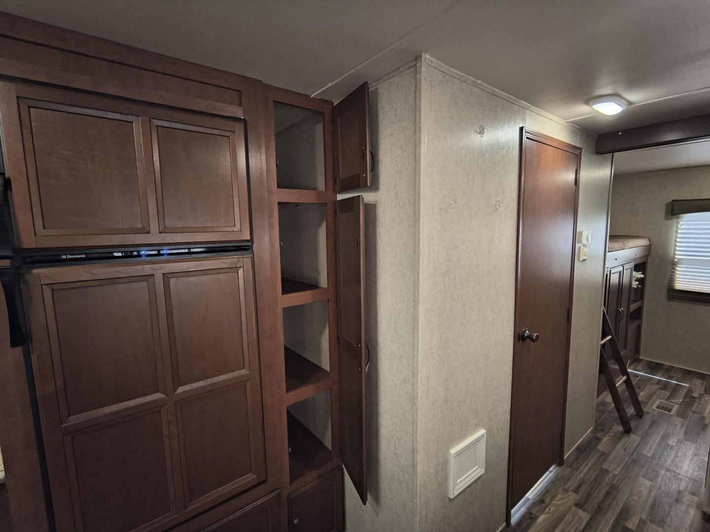 2015 White /BROWN Forest River PUMA 31BHSS 31BHSS (4X4TPUG23FP) , located at 17760 Hwy 62, Morris, OK, 74445, 35.609104, -95.877060 - CAMPING SEASON IS RIGHT AROUND THE CORNER SO CHECK OUT THIS 2015 FOREST RIVER PUMA 31BHSS 34.5FT OVERALL WITH 15FT POWER AWNING. IN THE FRONT IS THE MASTER BEDROOM WITH A QUEEN SIZE BED, STORAGE UNDER THE BED, TWO WARDROBE CLOSETS, AND OVERHEAD CABINETS. IN THE LIVING AND KITCHEN AREA THERE IS A ENT - Photo#31