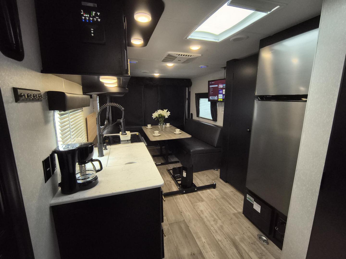 2022 Grey /Black Forest River 22RR - (4X4TCKX20NK) , located at 17760 Hwy 62, Morris, OK, 74445, 35.609104, -95.877060 - SPRING HAS SPRUNG AND SUMMER IS ON THE WAY!!! BIKERS WILL ENJOY THIS TOY HAULER. IT IS READY TO HIT THE ROAD AND ENJOY YOUR SUMMER. THIS CAMPER IS 30FT OVERALL HAS A QUEEN SIZED MASTER BED WITH A CLOSET WARDROBE ON EACH SIDE AND TV MOUNT. THE BATHROOM HAS A STANDUP ENCLOSED SHOWER WITH SINK AND VANI - Photo#10