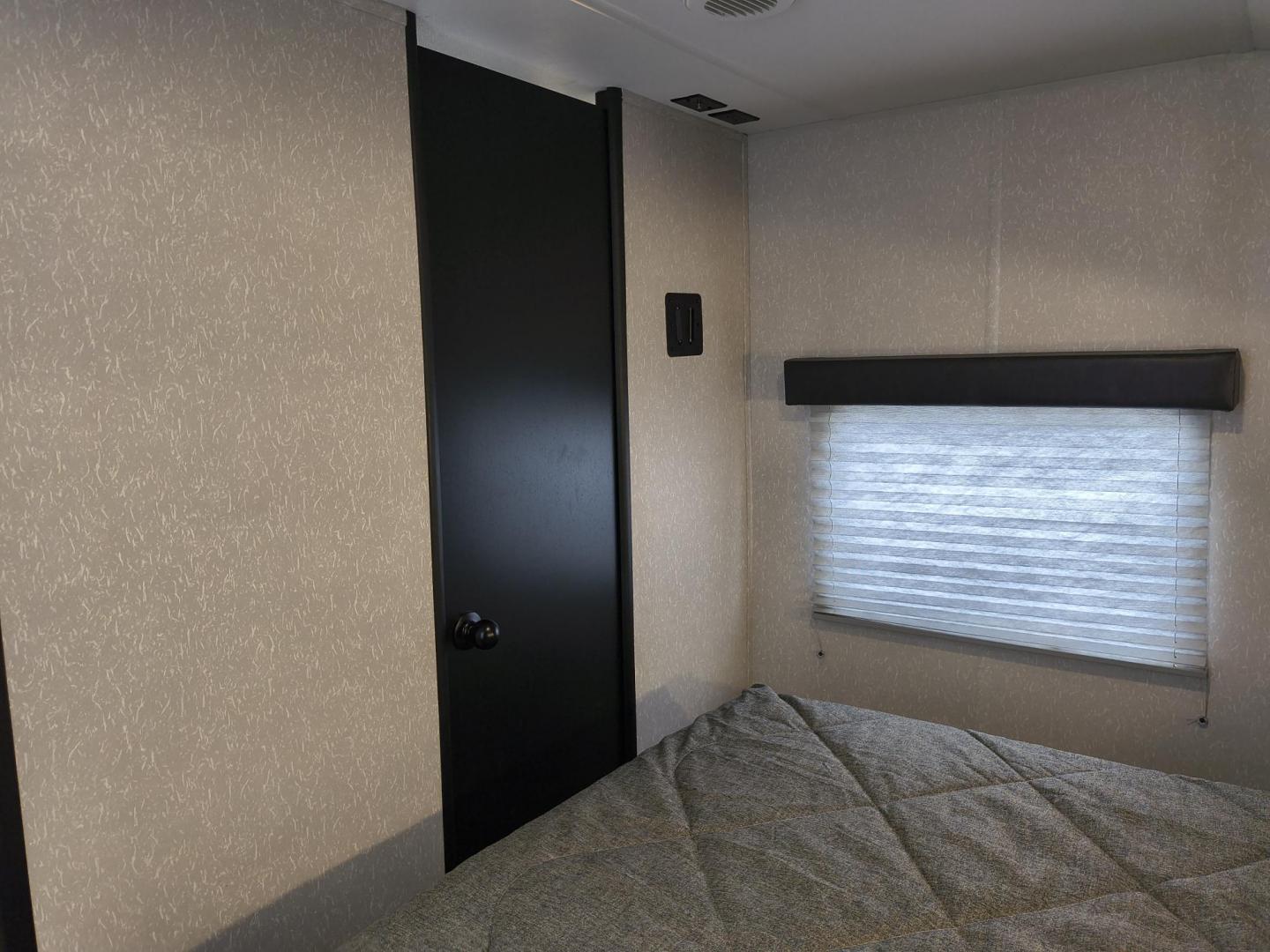 2022 Grey /Black Forest River 22RR - (4X4TCKX20NK) , located at 17760 Hwy 62, Morris, OK, 74445, 35.609104, -95.877060 - SPRING HAS SPRUNG AND SUMMER IS ON THE WAY!!! BIKERS WILL ENJOY THIS TOY HAULER. IT IS READY TO HIT THE ROAD AND ENJOY YOUR SUMMER. THIS CAMPER IS 30FT OVERALL HAS A QUEEN SIZED MASTER BED WITH A CLOSET WARDROBE ON EACH SIDE AND TV MOUNT. THE BATHROOM HAS A STANDUP ENCLOSED SHOWER WITH SINK AND VANI - Photo#14