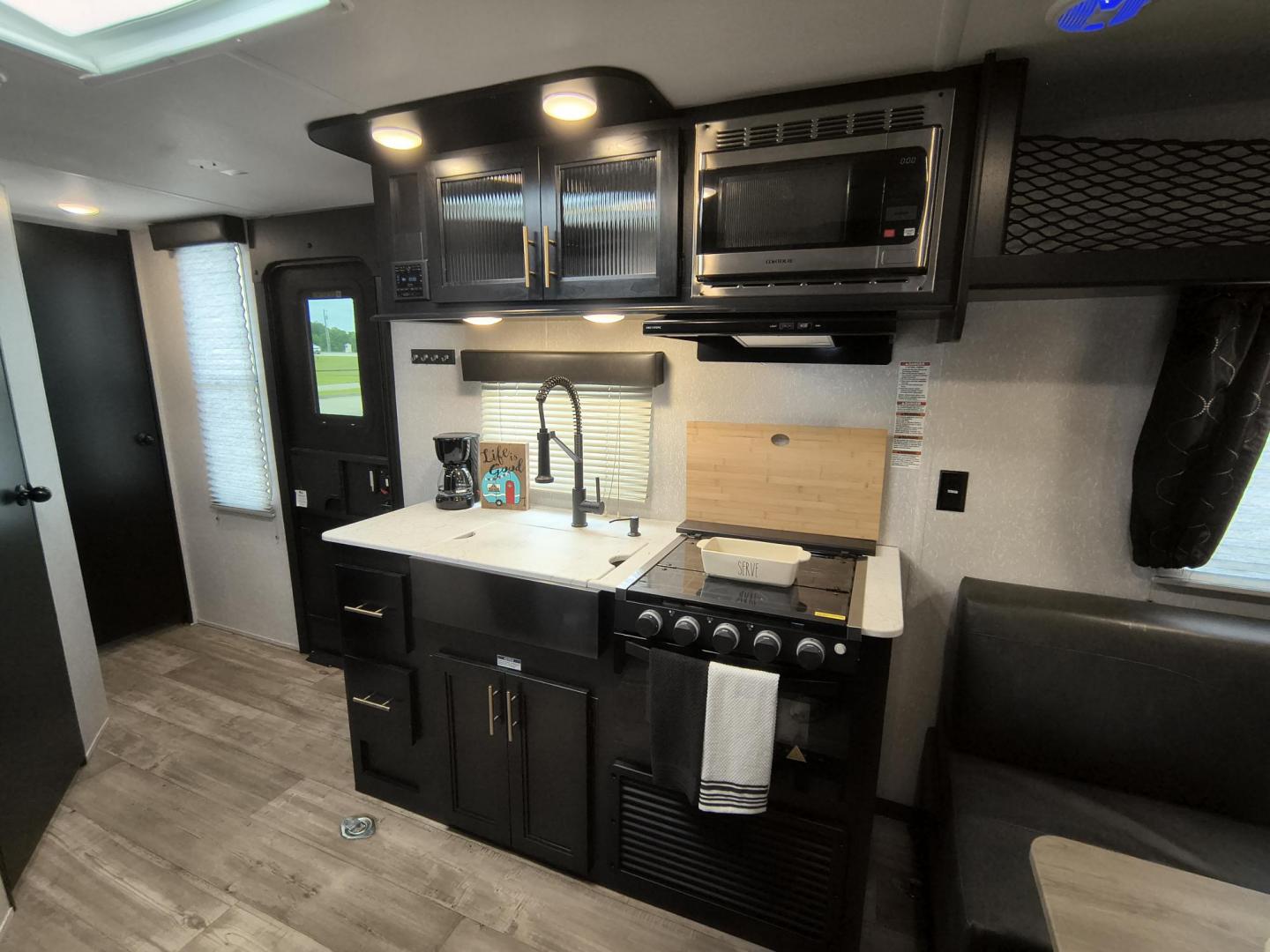 2022 Grey /Black Forest River 22RR - (4X4TCKX20NK) , located at 17760 Hwy 62, Morris, OK, 74445, 35.609104, -95.877060 - SPRING HAS SPRUNG AND SUMMER IS ON THE WAY!!! BIKERS WILL ENJOY THIS TOY HAULER. IT IS READY TO HIT THE ROAD AND ENJOY YOUR SUMMER. THIS CAMPER IS 30FT OVERALL HAS A QUEEN SIZED MASTER BED WITH A CLOSET WARDROBE ON EACH SIDE AND TV MOUNT. THE BATHROOM HAS A STANDUP ENCLOSED SHOWER WITH SINK AND VANI - Photo#16