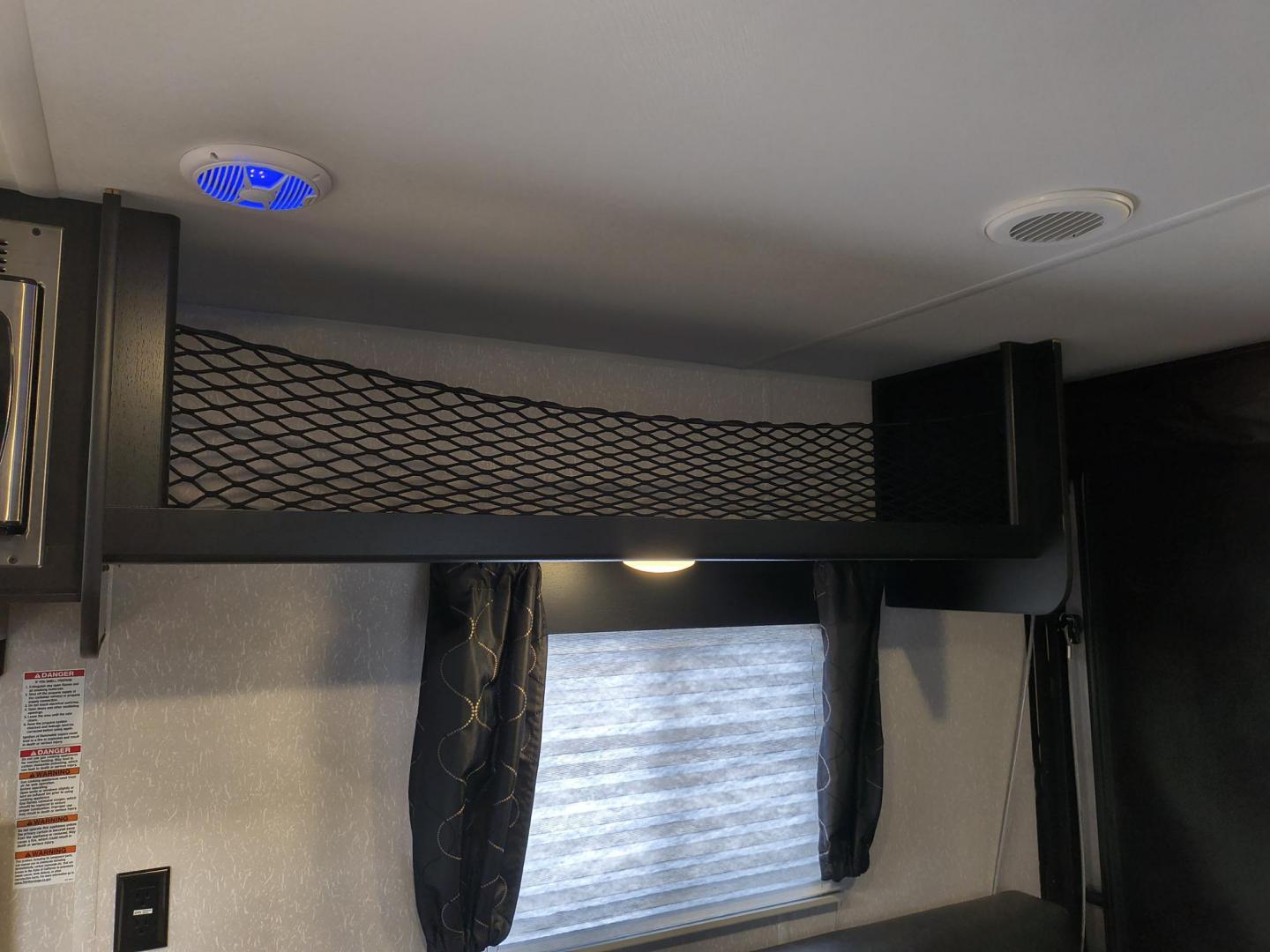 2022 Grey /Black Forest River 22RR - (4X4TCKX20NK) , located at 17760 Hwy 62, Morris, OK, 74445, 35.609104, -95.877060 - SPRING HAS SPRUNG AND SUMMER IS ON THE WAY!!! BIKERS WILL ENJOY THIS TOY HAULER. IT IS READY TO HIT THE ROAD AND ENJOY YOUR SUMMER. THIS CAMPER IS 30FT OVERALL HAS A QUEEN SIZED MASTER BED WITH A CLOSET WARDROBE ON EACH SIDE AND TV MOUNT. THE BATHROOM HAS A STANDUP ENCLOSED SHOWER WITH SINK AND VANI - Photo#26