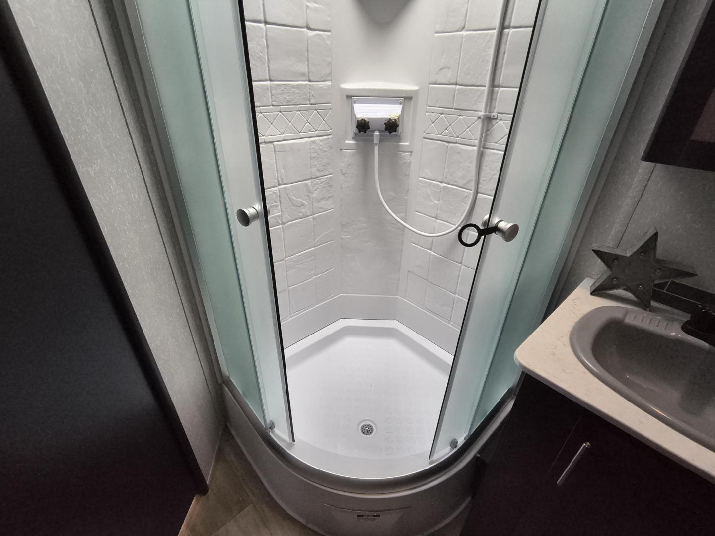 2022 Grey /Black Forest River 22RR - (4X4TCKX20NK) , located at 17760 Hwy 62, Morris, OK, 74445, 35.609104, -95.877060 - SPRING HAS SPRUNG AND SUMMER IS ON THE WAY!!! BIKERS WILL ENJOY THIS TOY HAULER. IT IS READY TO HIT THE ROAD AND ENJOY YOUR SUMMER. THIS CAMPER IS 30FT OVERALL HAS A QUEEN SIZED MASTER BED WITH A CLOSET WARDROBE ON EACH SIDE AND TV MOUNT. THE BATHROOM HAS A STANDUP ENCLOSED SHOWER WITH SINK AND VANI - Photo#36