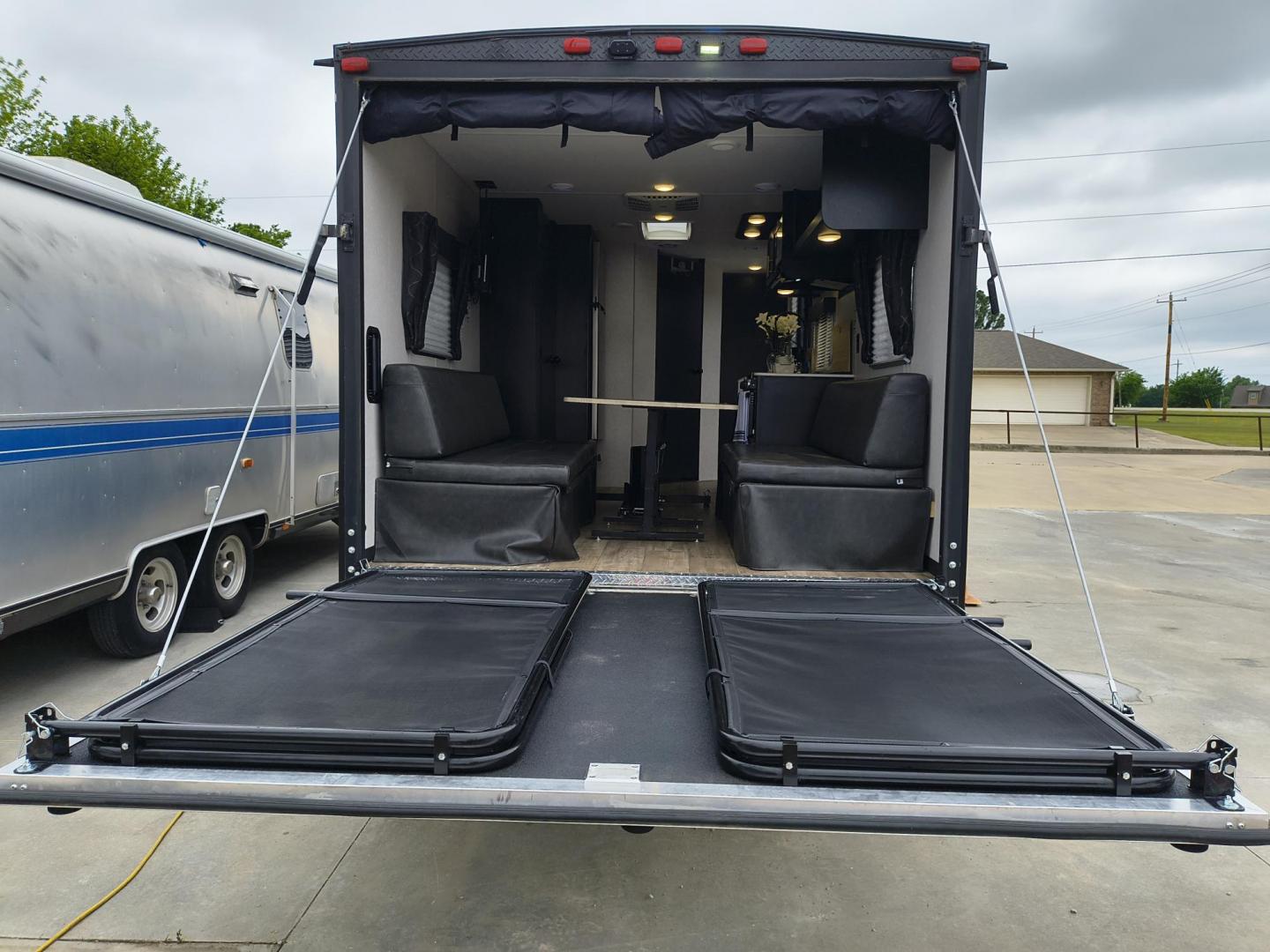 2022 Grey /Black Forest River 22RR - (4X4TCKX20NK) , located at 17760 Hwy 62, Morris, OK, 74445, 35.609104, -95.877060 - SPRING HAS SPRUNG AND SUMMER IS ON THE WAY!!! BIKERS WILL ENJOY THIS TOY HAULER. IT IS READY TO HIT THE ROAD AND ENJOY YOUR SUMMER. THIS CAMPER IS 30FT OVERALL HAS A QUEEN SIZED MASTER BED WITH A CLOSET WARDROBE ON EACH SIDE AND TV MOUNT. THE BATHROOM HAS A STANDUP ENCLOSED SHOWER WITH SINK AND VANI - Photo#37