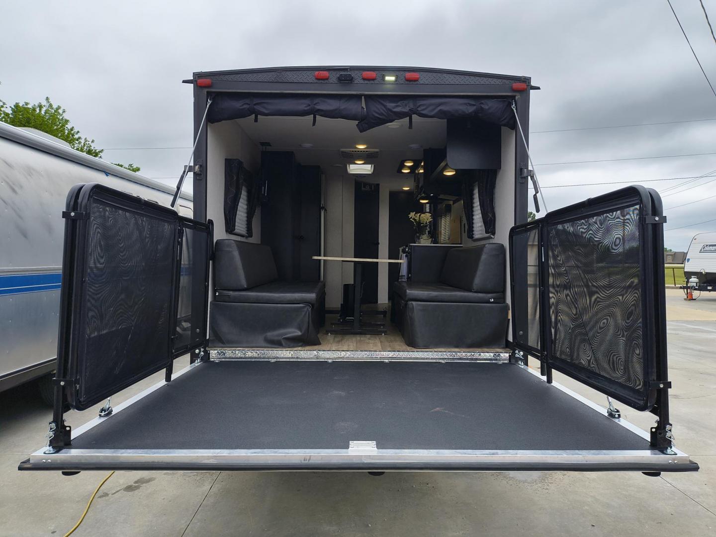 2022 Grey /Black Forest River 22RR - (4X4TCKX20NK) , located at 17760 Hwy 62, Morris, OK, 74445, 35.609104, -95.877060 - SPRING HAS SPRUNG AND SUMMER IS ON THE WAY!!! BIKERS WILL ENJOY THIS TOY HAULER. IT IS READY TO HIT THE ROAD AND ENJOY YOUR SUMMER. THIS CAMPER IS 30FT OVERALL HAS A QUEEN SIZED MASTER BED WITH A CLOSET WARDROBE ON EACH SIDE AND TV MOUNT. THE BATHROOM HAS A STANDUP ENCLOSED SHOWER WITH SINK AND VANI - Photo#38